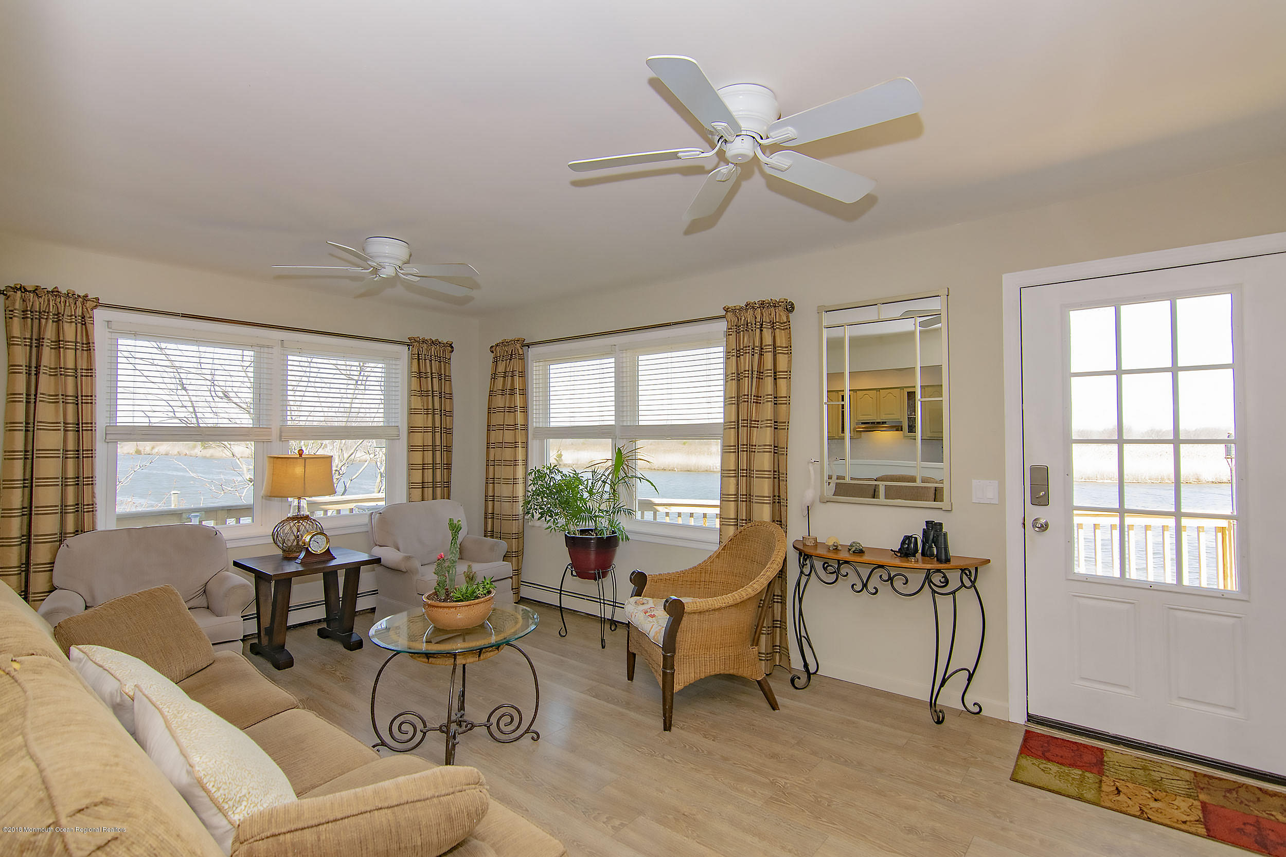 43 Compass Road Waretown, NJ 08758 - Photo 4 of 27 a living room with furniture and a window