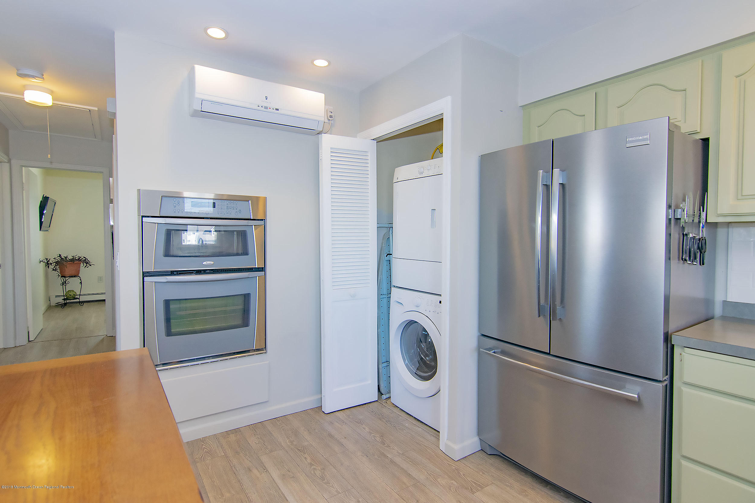 43 Compass Road Waretown, NJ 08758 - Photo 8 of 27 a metallic refrigerator freezer sitting in a kitchen