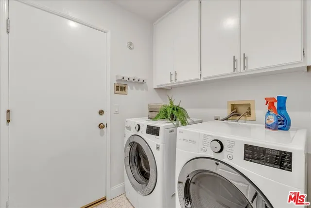 a spacious bedroom with a bed and a couch