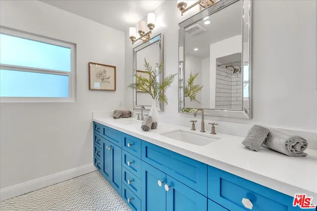 a bathroom with a tub sink and mirror