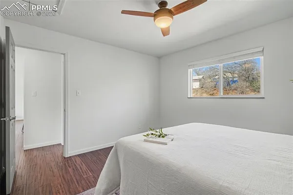 a bedroom with bed and window