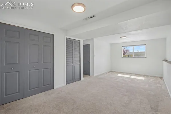 a view of an empty room and window