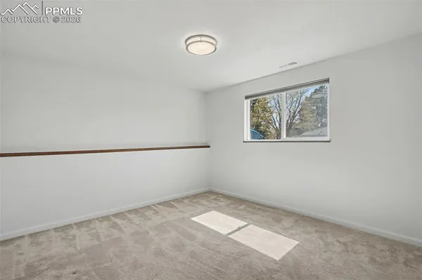 an empty room with a workbench