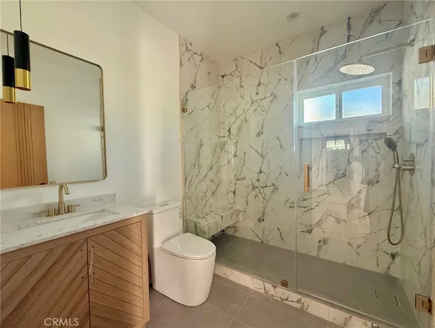 a bathroom with a shower and a sink