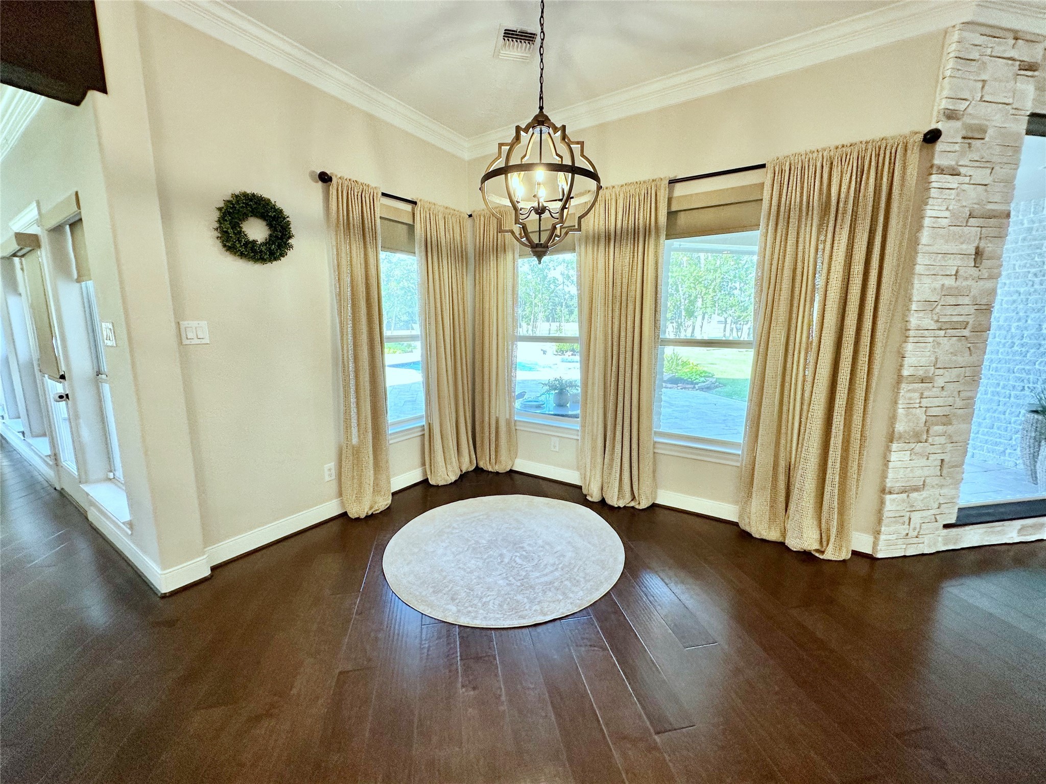 2904 Bridle Path Lane Friendswood, TX 77546 - Photo 14 of 49 a view of an empty room with wooden floor and a window