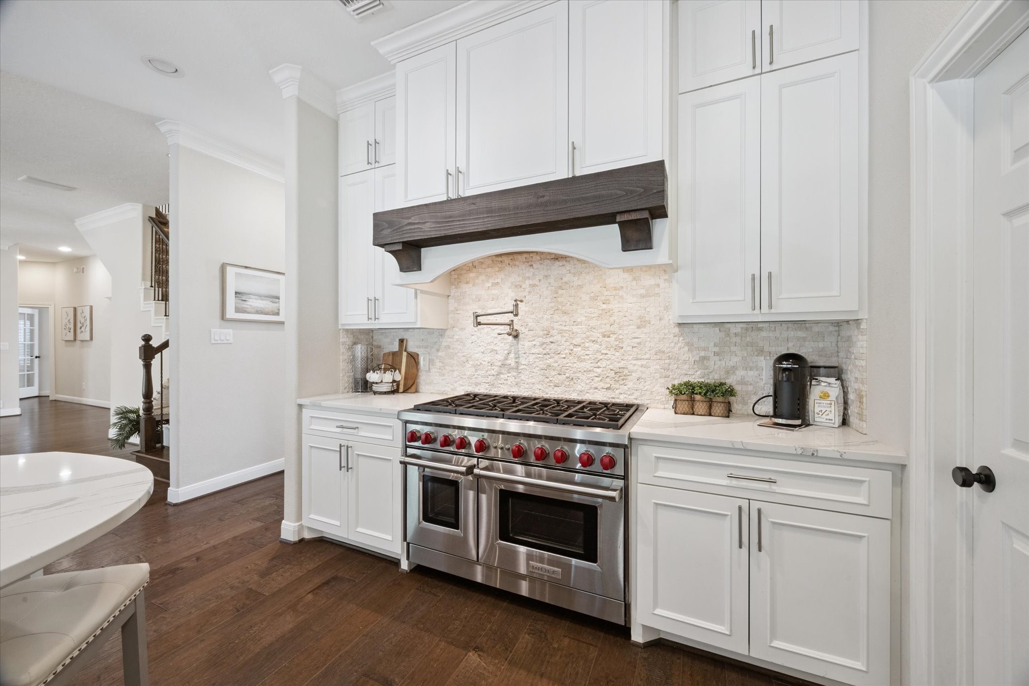 2904 Bridle Path Lane Friendswood, TX 77546 - Photo 15 of 49 The light cabinetry and elegant finishes set the stage for unforgettable entertaining and a warm, welcoming atmosphere.