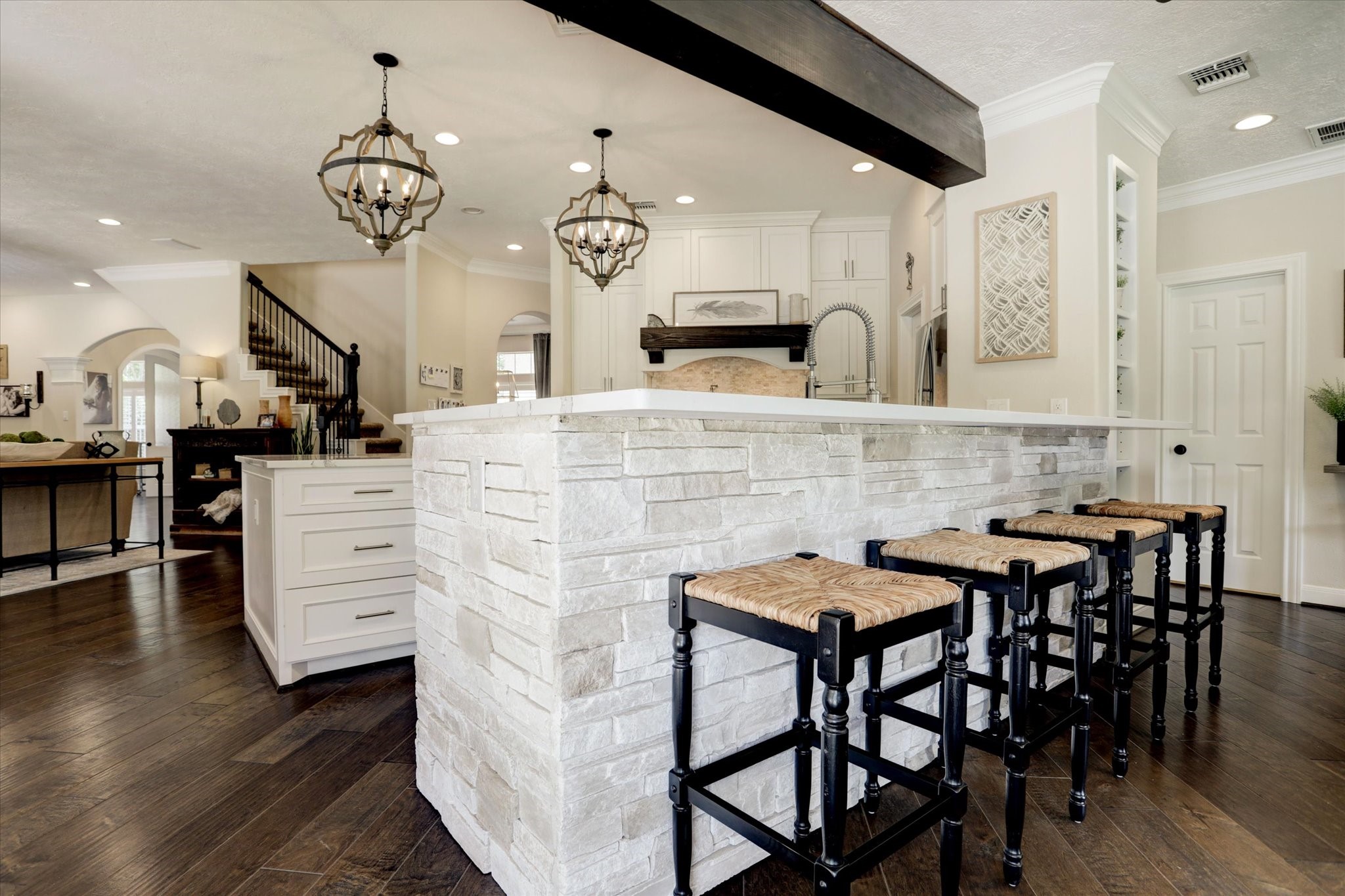 2904 Bridle Path Lane Friendswood, TX 77546 - Photo 19 of 49 a kitchen with stainless steel appliances kitchen island granite countertop a table chairs sink and cabinets