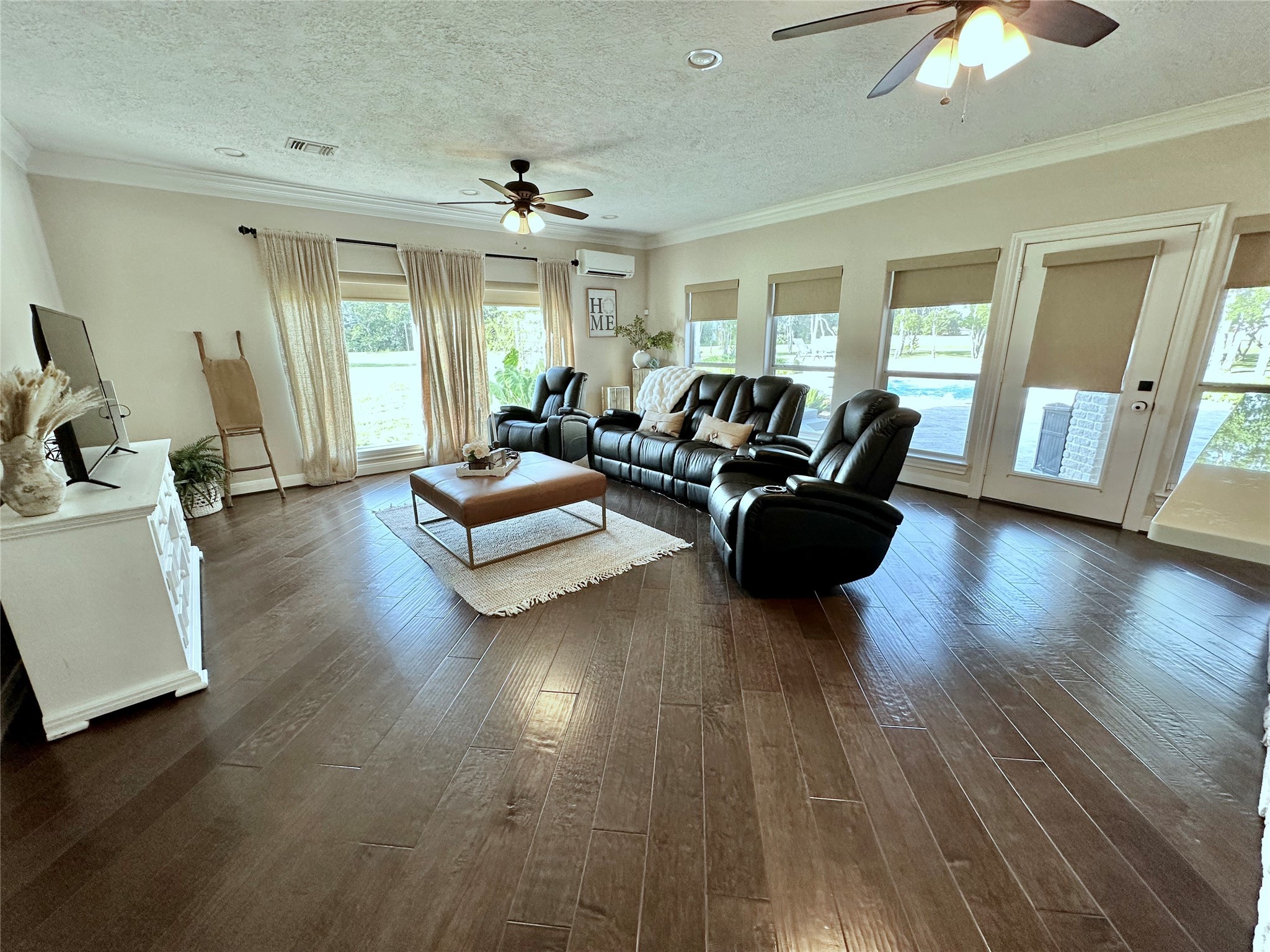 2904 Bridle Path Lane Friendswood, TX 77546 - Photo 21 of 49 The den features walls of windows that flood the space with natural light and showcase stunning views of the backyard oasis. A glass door provides direct access to the outdoor retreat, making indoor-outdoor living a breeze.