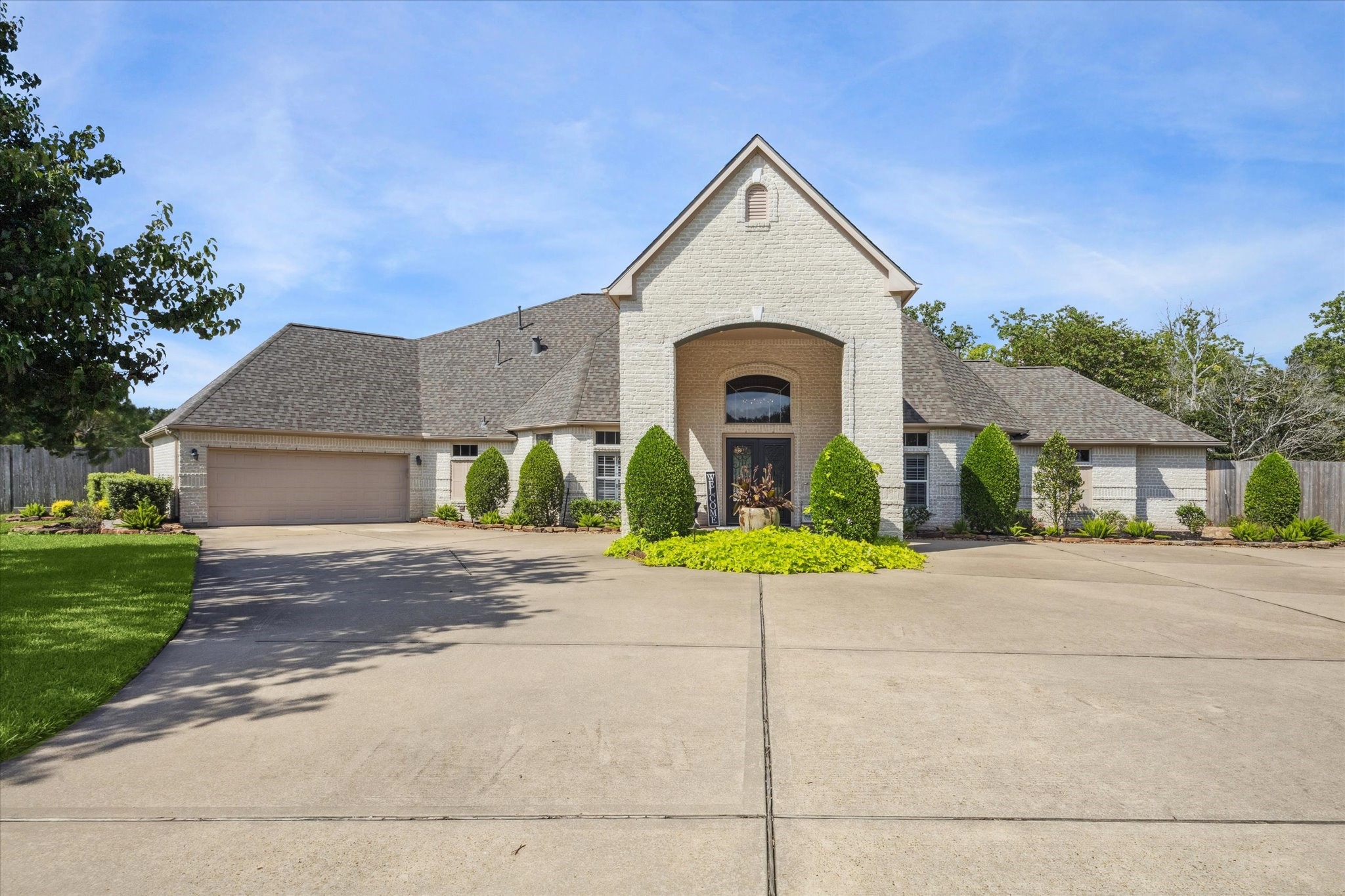 2904 Bridle Path Lane Friendswood, TX 77546 - Photo 3 of 49 a front view of a house with a yard and garage