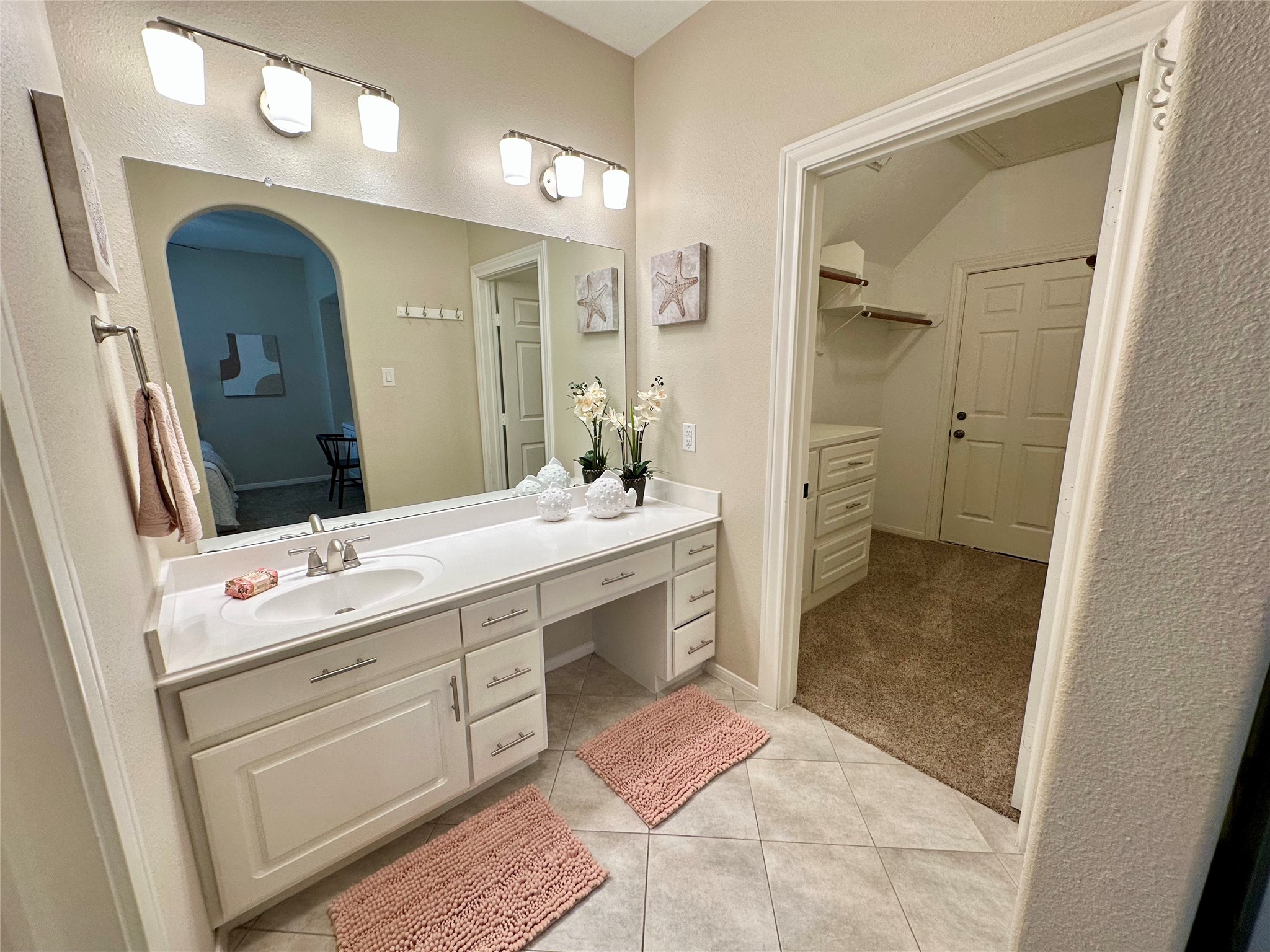 2904 Bridle Path Lane Friendswood, TX 77546 - Photo 35 of 49 The bathroom connects directly to the walk-in closet and provides convenient access to generous attic storage.