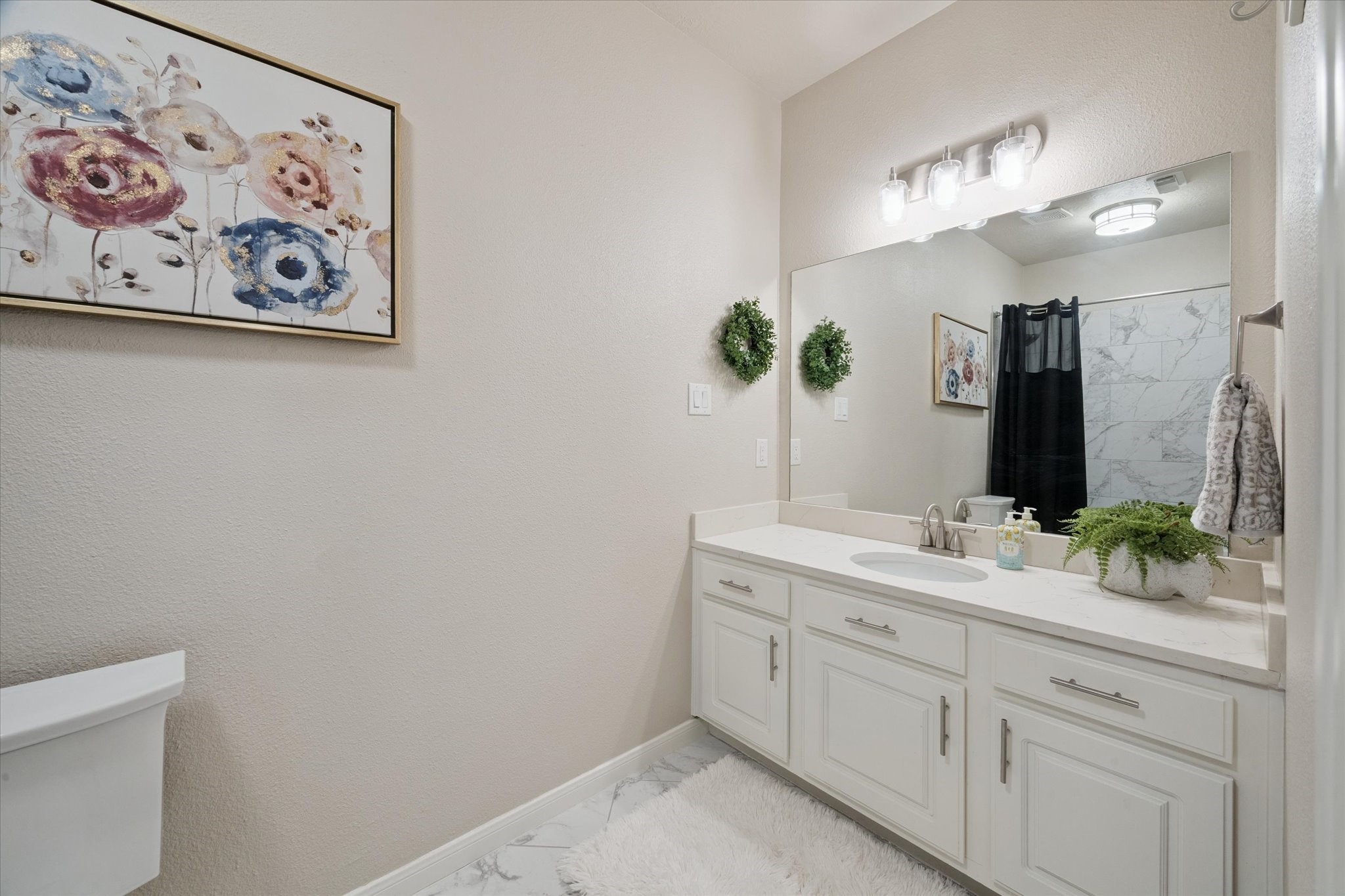 2904 Bridle Path Lane Friendswood, TX 77546 - Photo 38 of 49 a spacious bathroom with a shower sink and two mirror