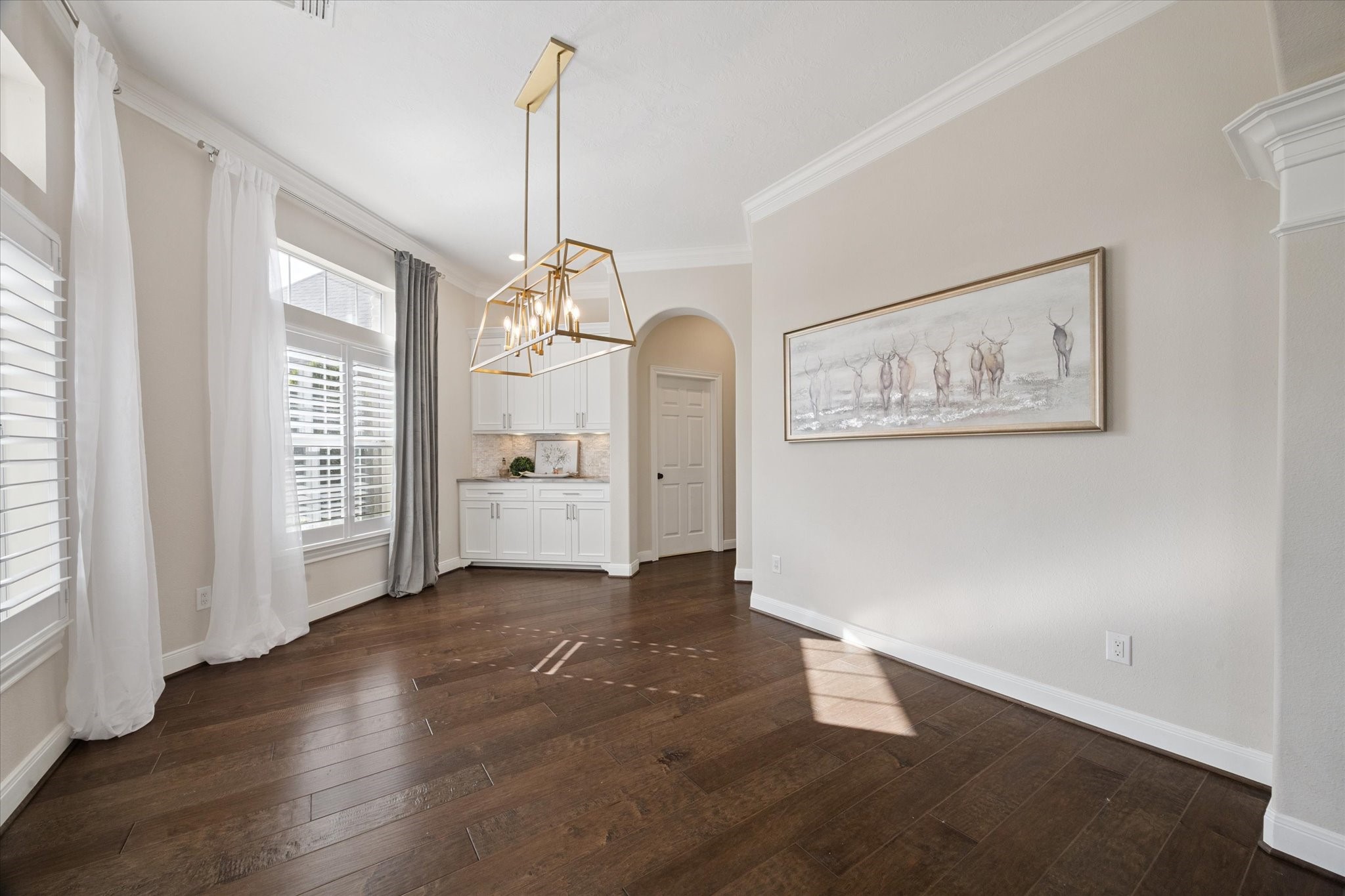 2904 Bridle Path Lane Friendswood, TX 77546 - Photo 9 of 49 a view of a big room with wooden floor and windows