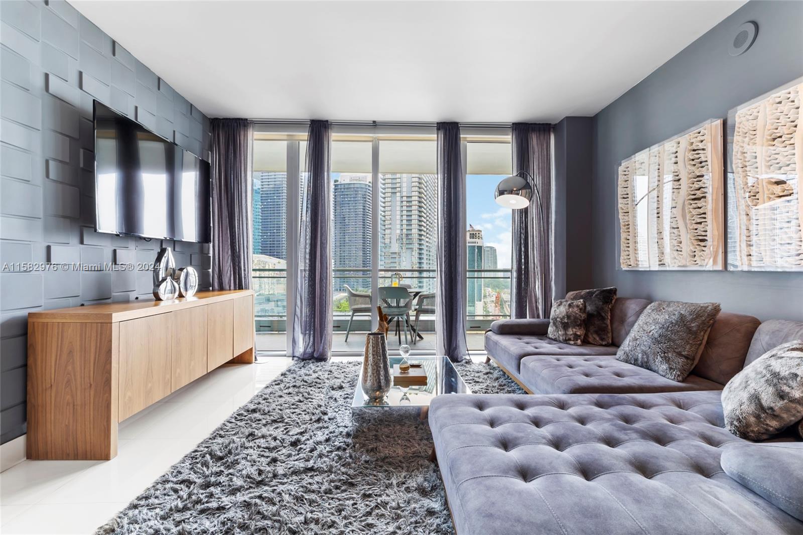 92 Southwest 3rd Street, Unit 2303 Miami, FL 33130 - Photo 15 of 35 a living room with furniture and a large window