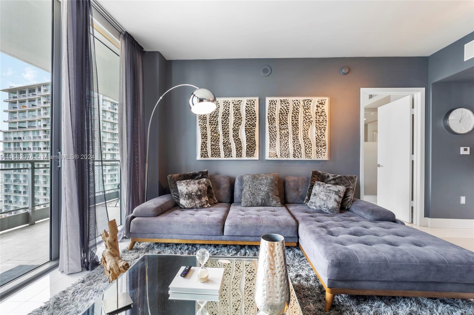 92 Southwest 3rd Street, Unit 2303 Miami, FL 33130 - Photo 16 of 35 a bedroom with a large bed and a window