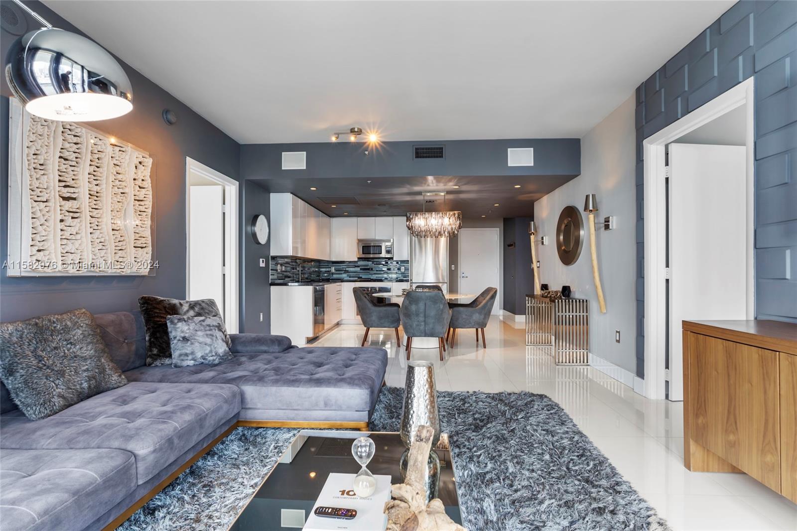 92 Southwest 3rd Street, Unit 2303 Miami, FL 33130 - Photo 17 of 35 a living room with furniture and a rug