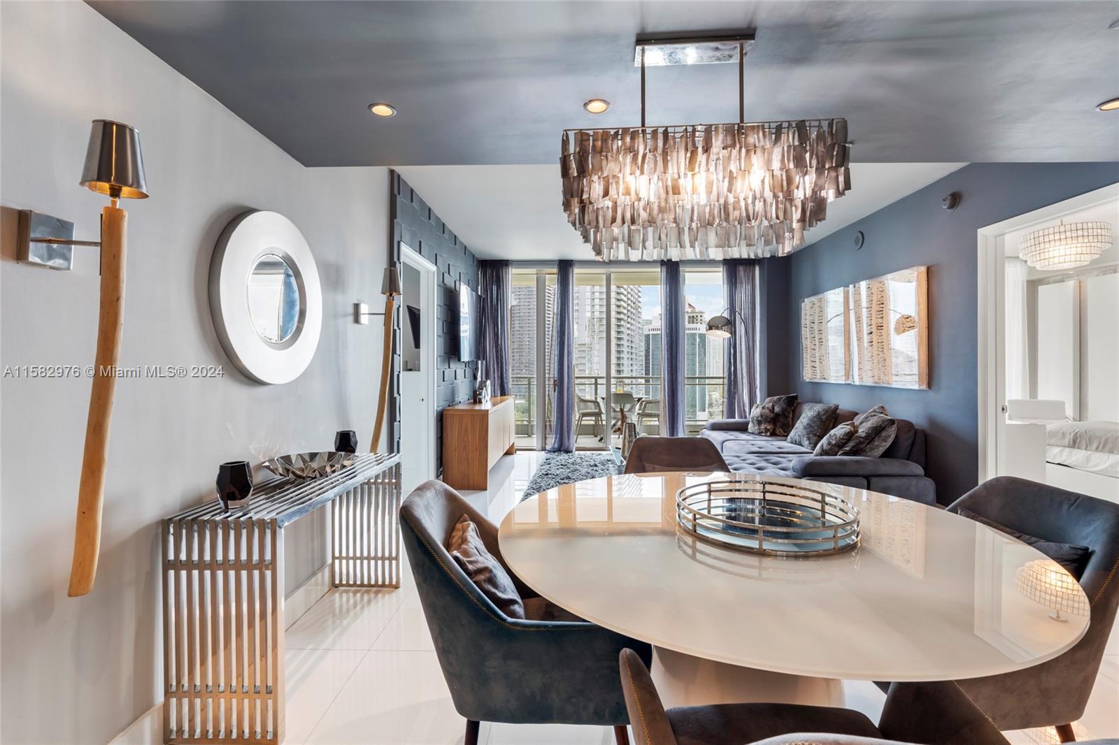 92 Southwest 3rd Street, Unit 2303 Miami, FL 33130 - Photo 6 of 35 a view of a dining room with furniture