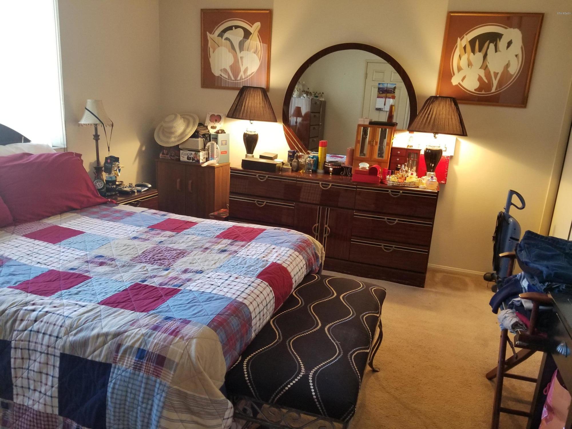 2047 East Bard Road Oxnard, CA 93033 - Photo 12 of 25 a bedroom with a bed and dresser