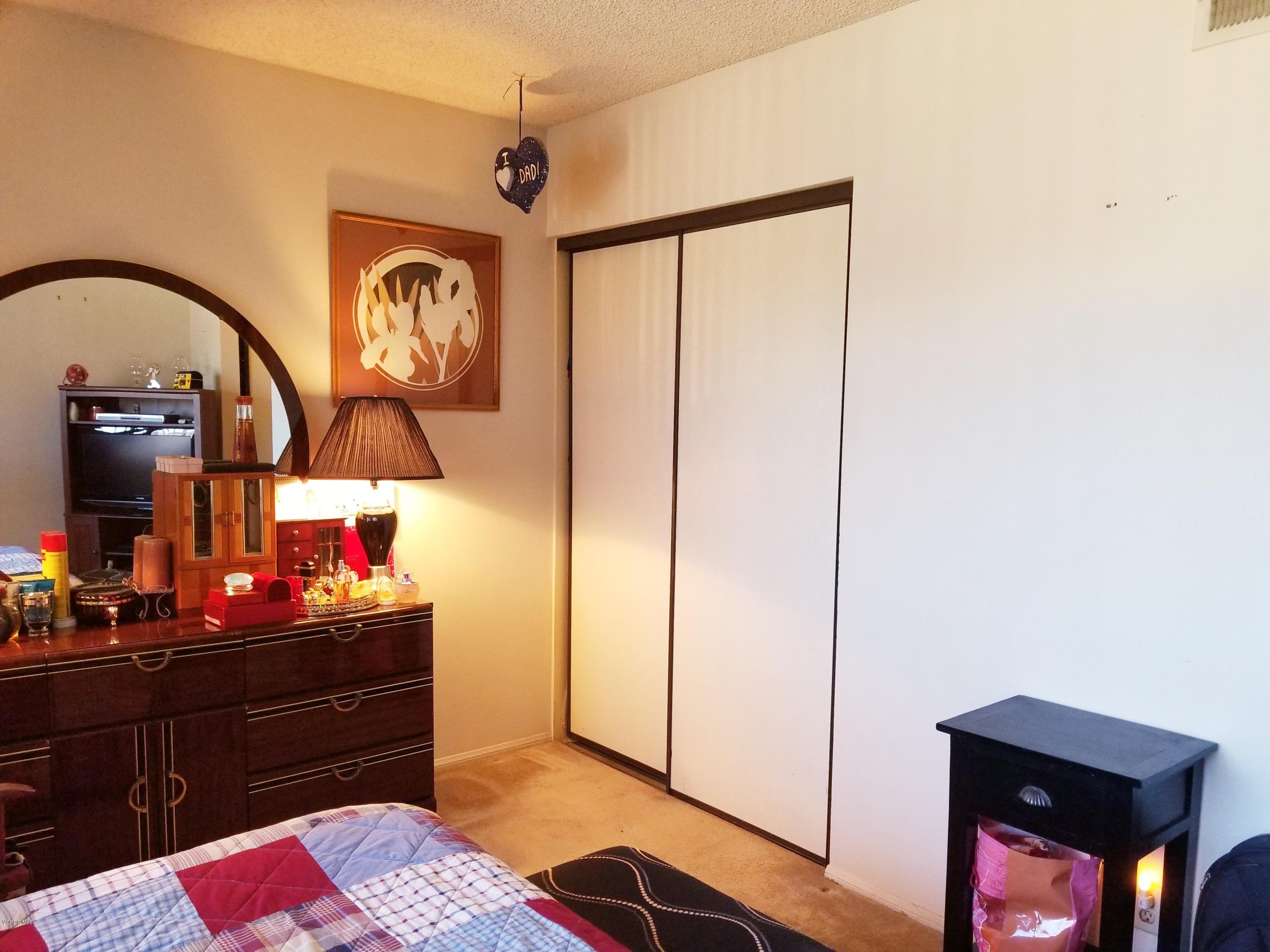 2047 East Bard Road Oxnard, CA 93033 - Photo 14 of 25 a bedroom with a bed and a dresser in it