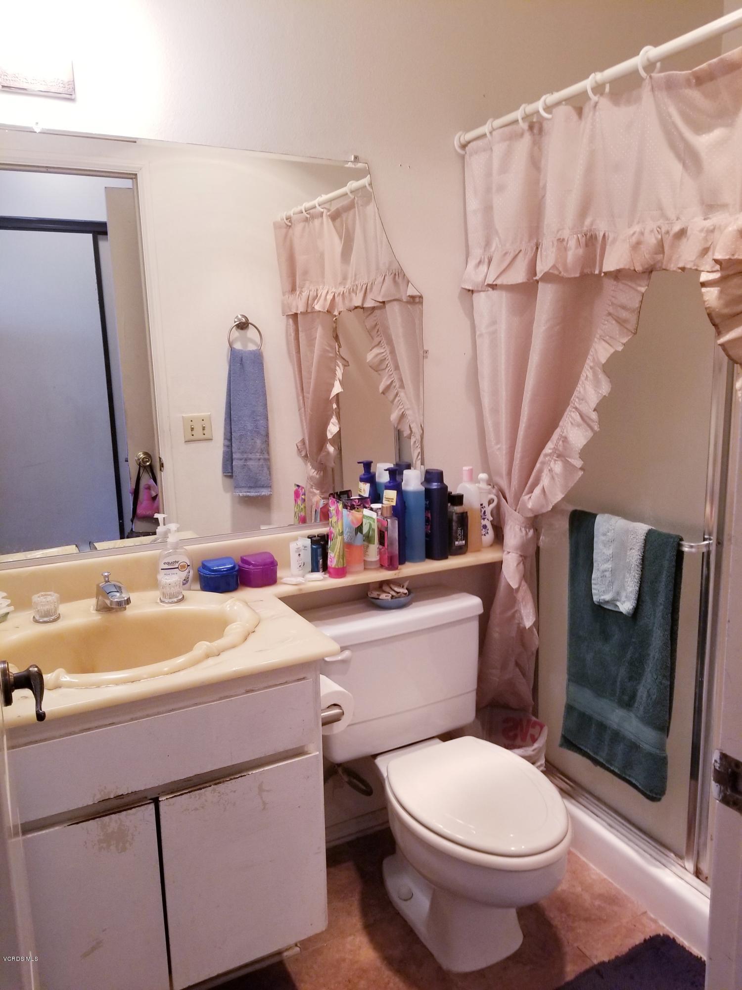 2047 East Bard Road Oxnard, CA 93033 - Photo 15 of 25 a bathroom with a sink toilet and shower
