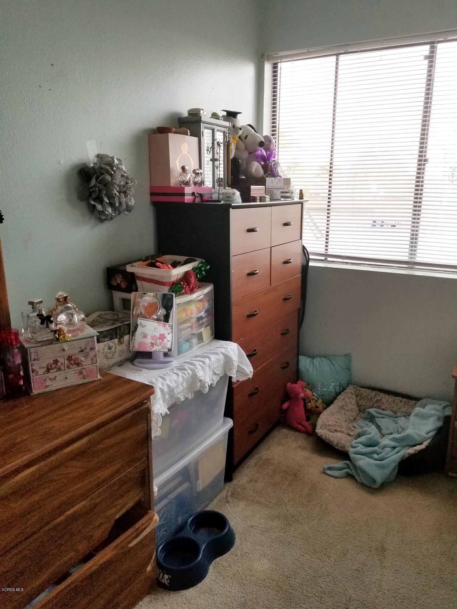 2047 East Bard Road Oxnard, CA 93033 - Photo 18 of 25 a bed room with furniture and a window