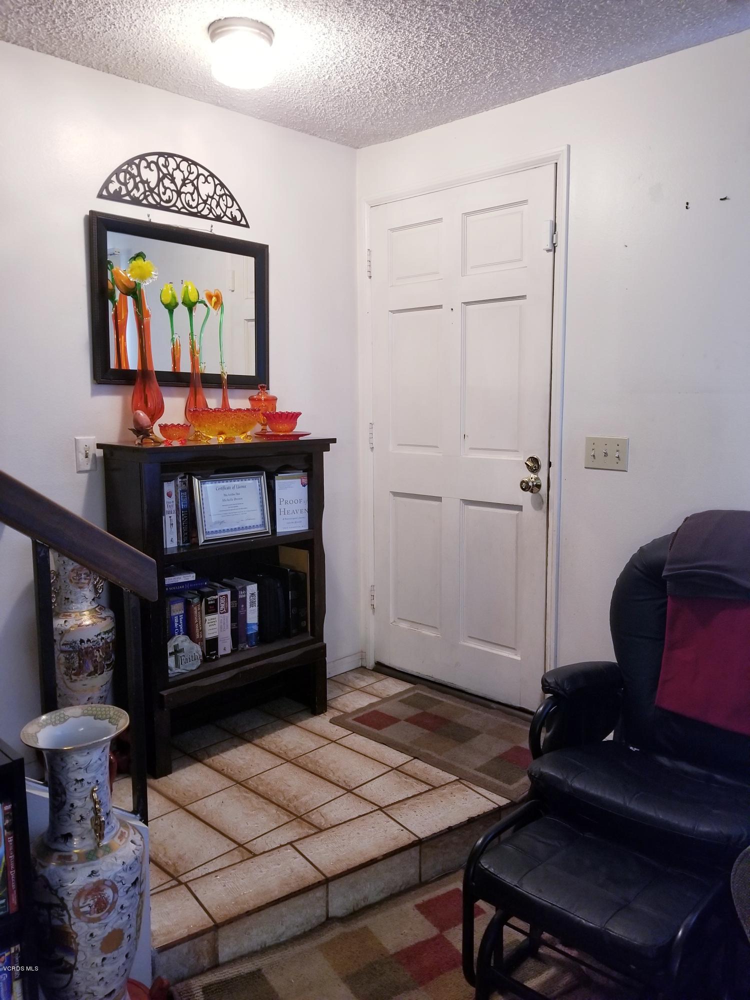 2047 East Bard Road Oxnard, CA 93033 - Photo 3 of 25 a living room with furniture and a fireplace