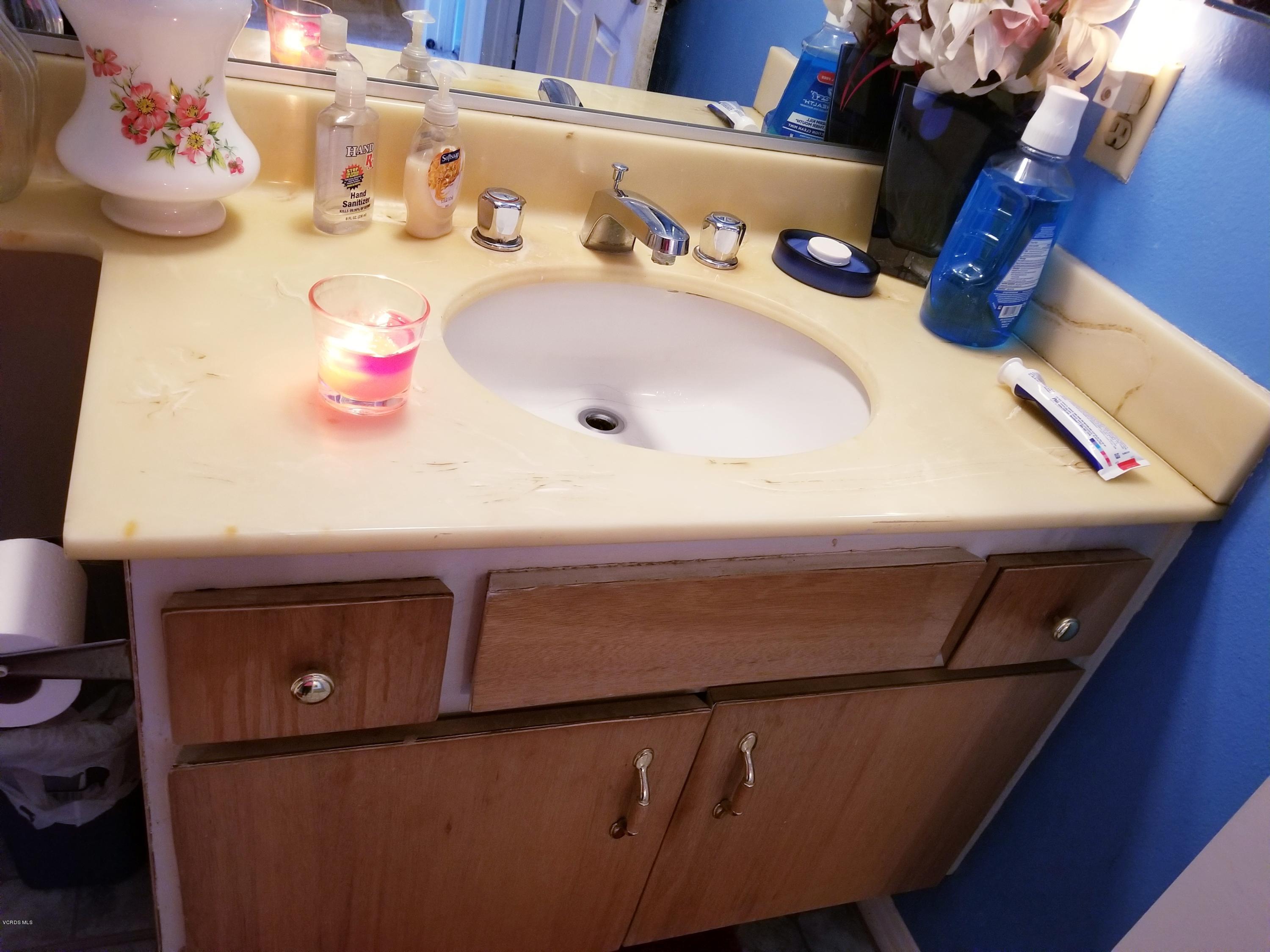 2047 East Bard Road Oxnard, CA 93033 - Photo 22 of 25 a bathroom with a sink and a mirror