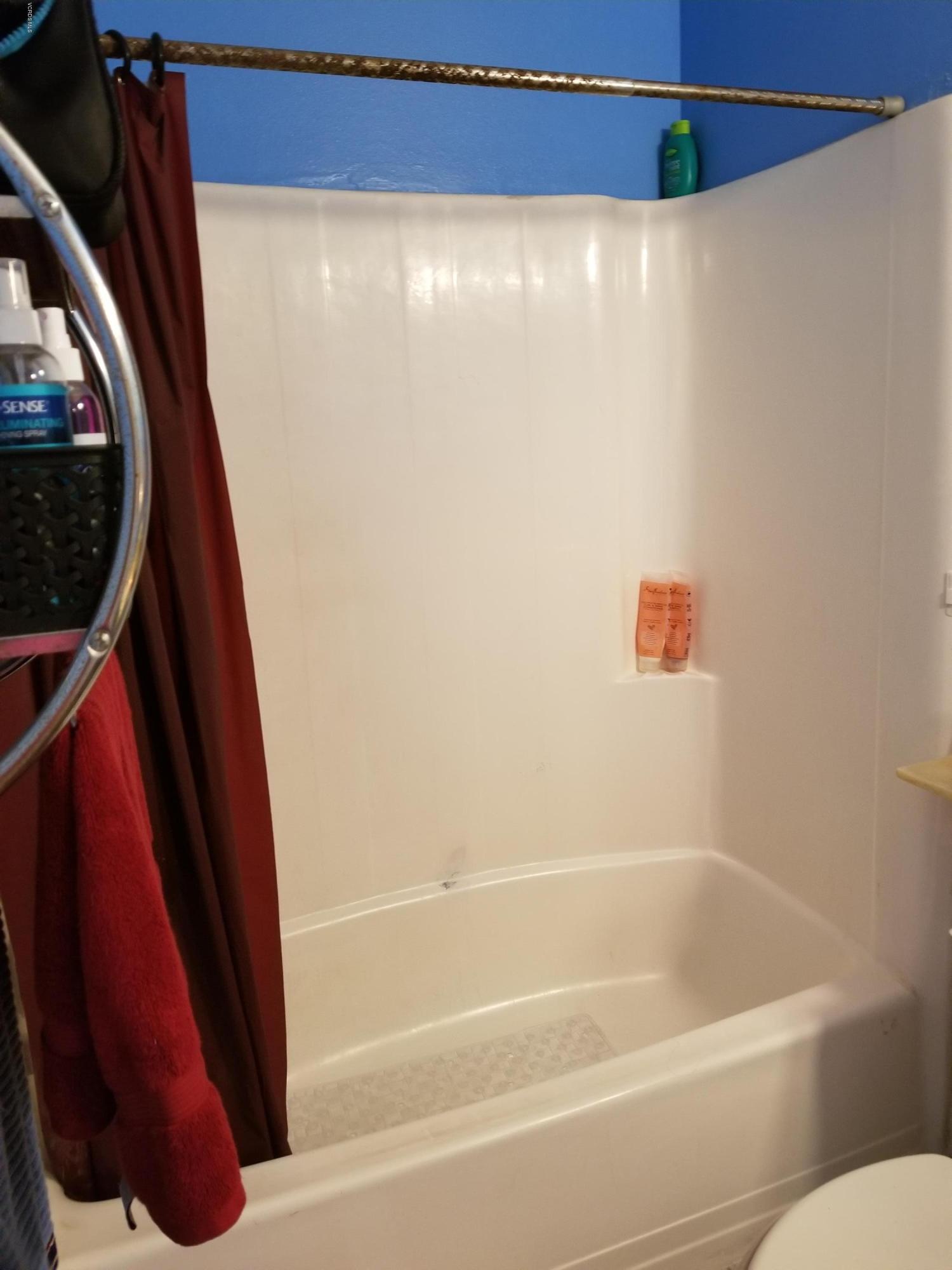 2047 East Bard Road Oxnard, CA 93033 - Photo 23 of 25 a bathroom with a shower and a toilet