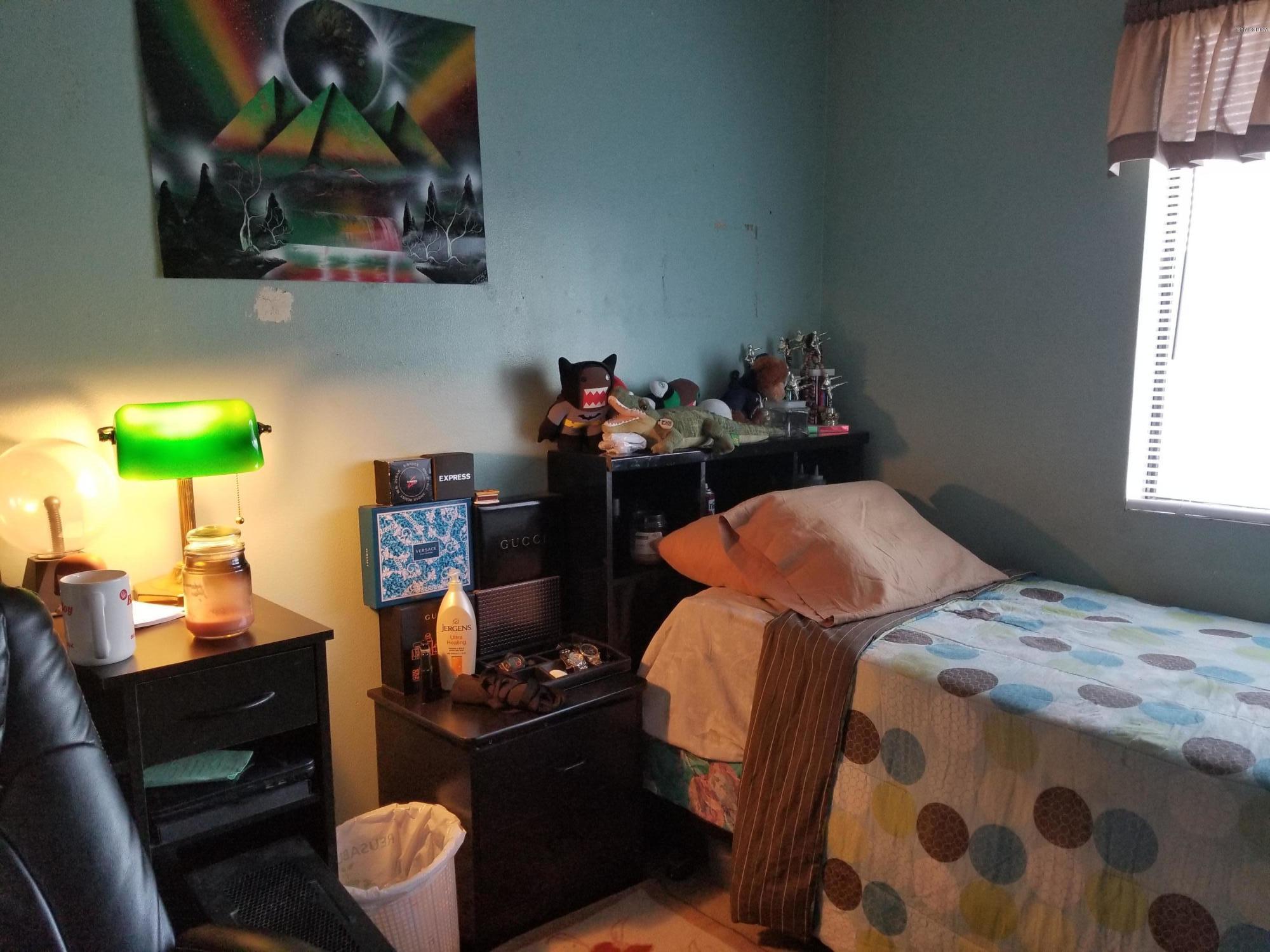 2047 East Bard Road Oxnard, CA 93033 - Photo 25 of 25 a bedroom with a bed and wooden floor