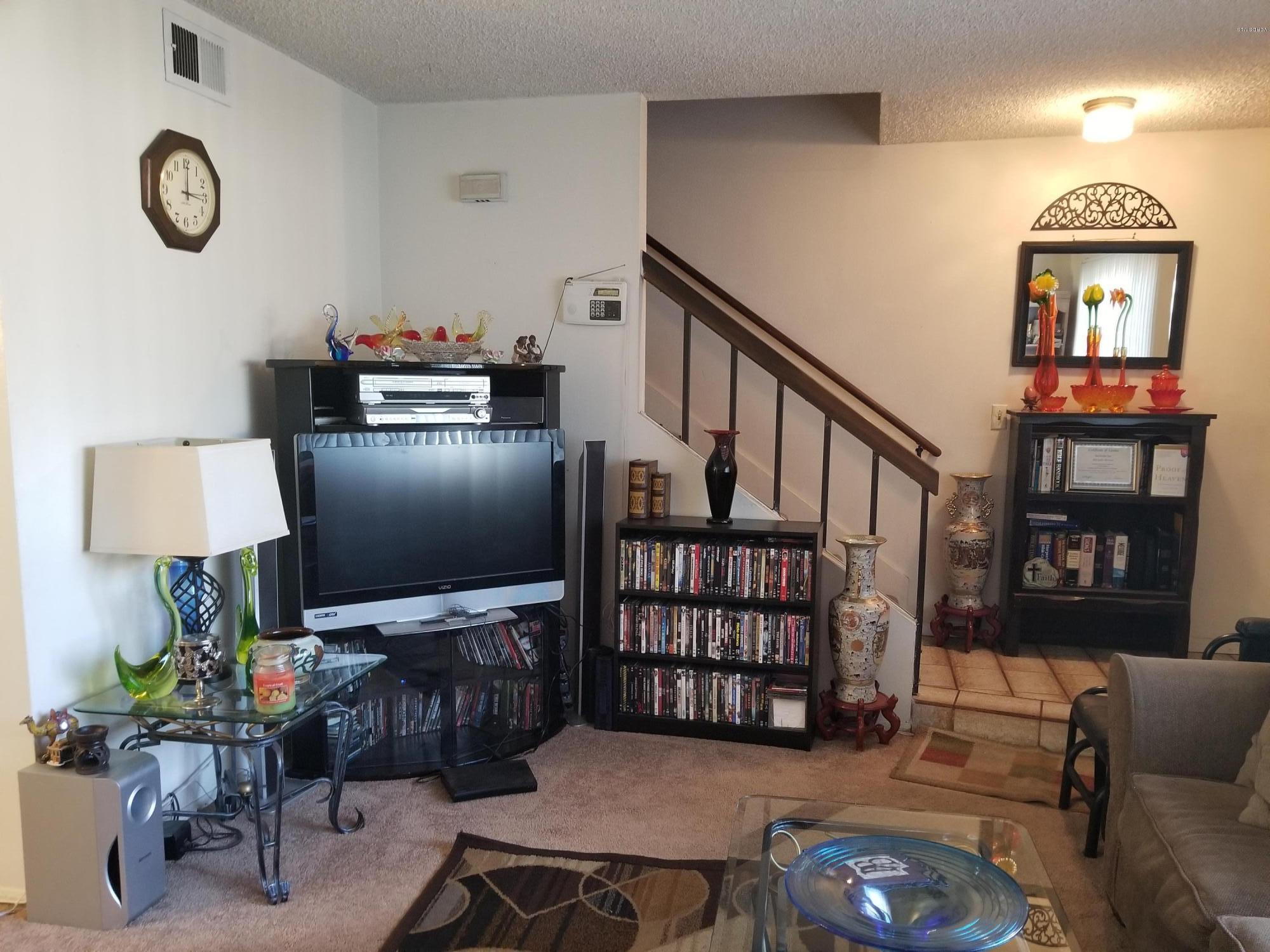 2047 East Bard Road Oxnard, CA 93033 - Photo 4 of 25 a view of a livingroom with furniture and a flat screen tv