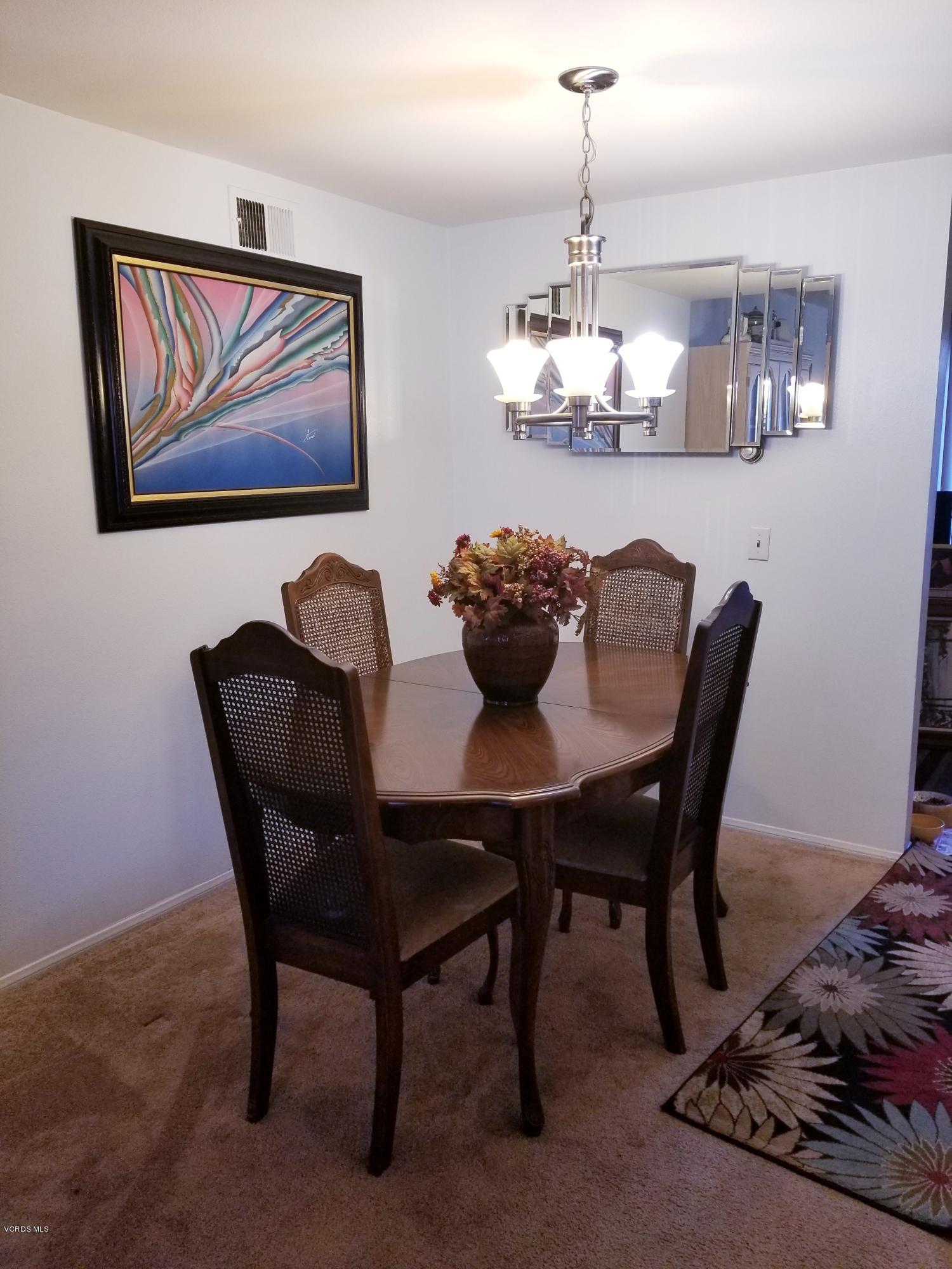 2047 East Bard Road Oxnard, CA 93033 - Photo 6 of 25 a dining room with furniture and chandelier