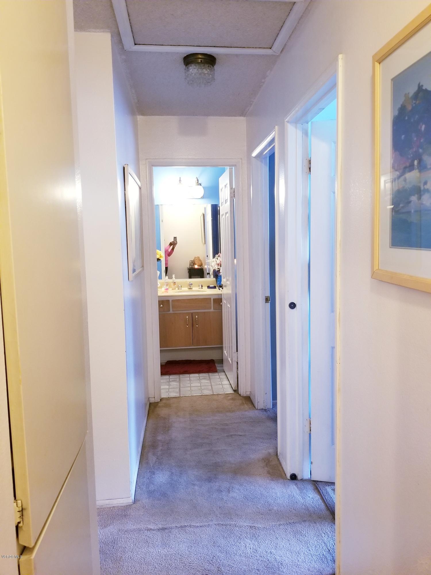 2047 East Bard Road Oxnard, CA 93033 - Photo 8 of 25 a view of a hallway with closet and wooden floor