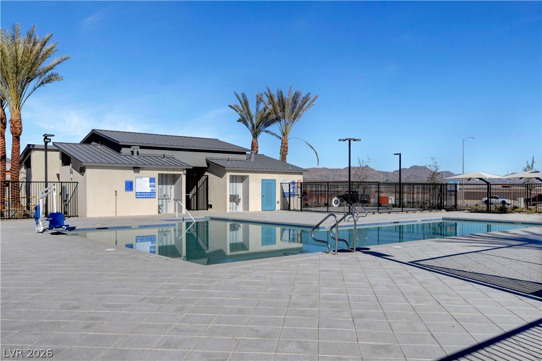 6924 Spicy Merlot Street North Las Vegas, NV 89086 - Photo 51 of 83 An inviting pool area with ample deck space awaits, surrounded by scenic desert mountain views.