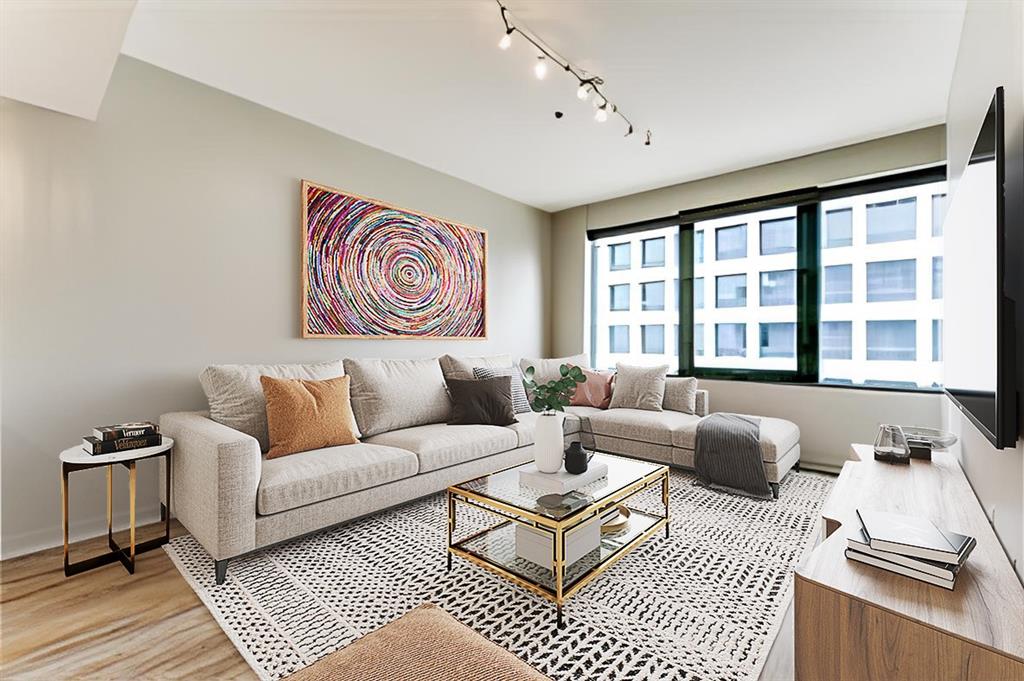 a living room with furniture and a window