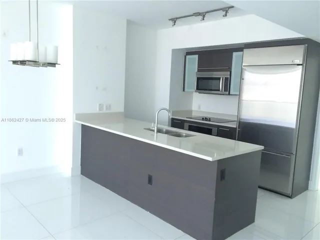 a kitchen with a sink and a window