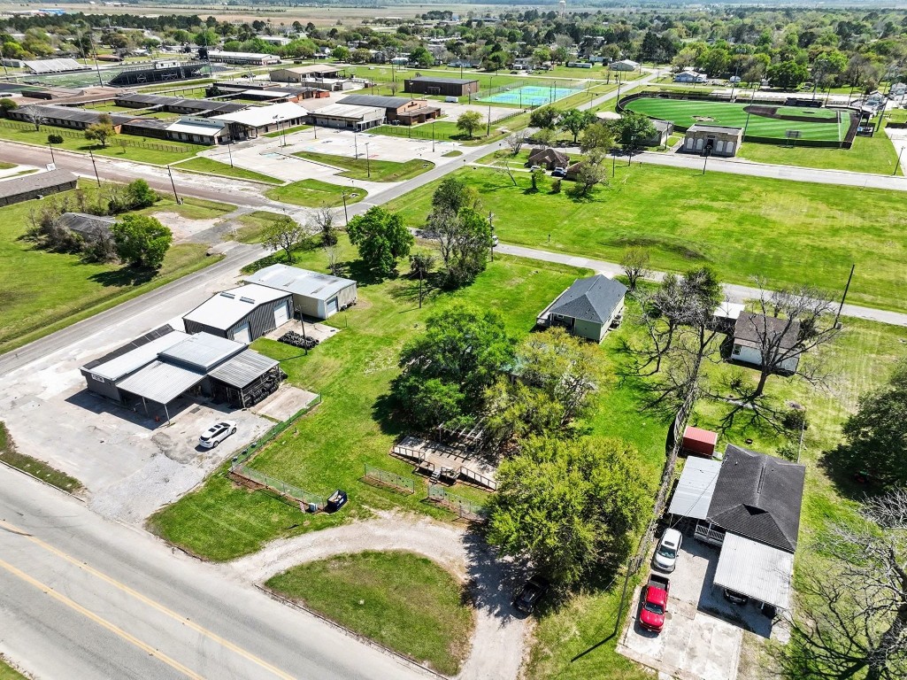 810 Miller Street Anahuac, TX 77514 - Photo 23 of 28 an aerial view of residential houses with outdoor space and swimming pool
