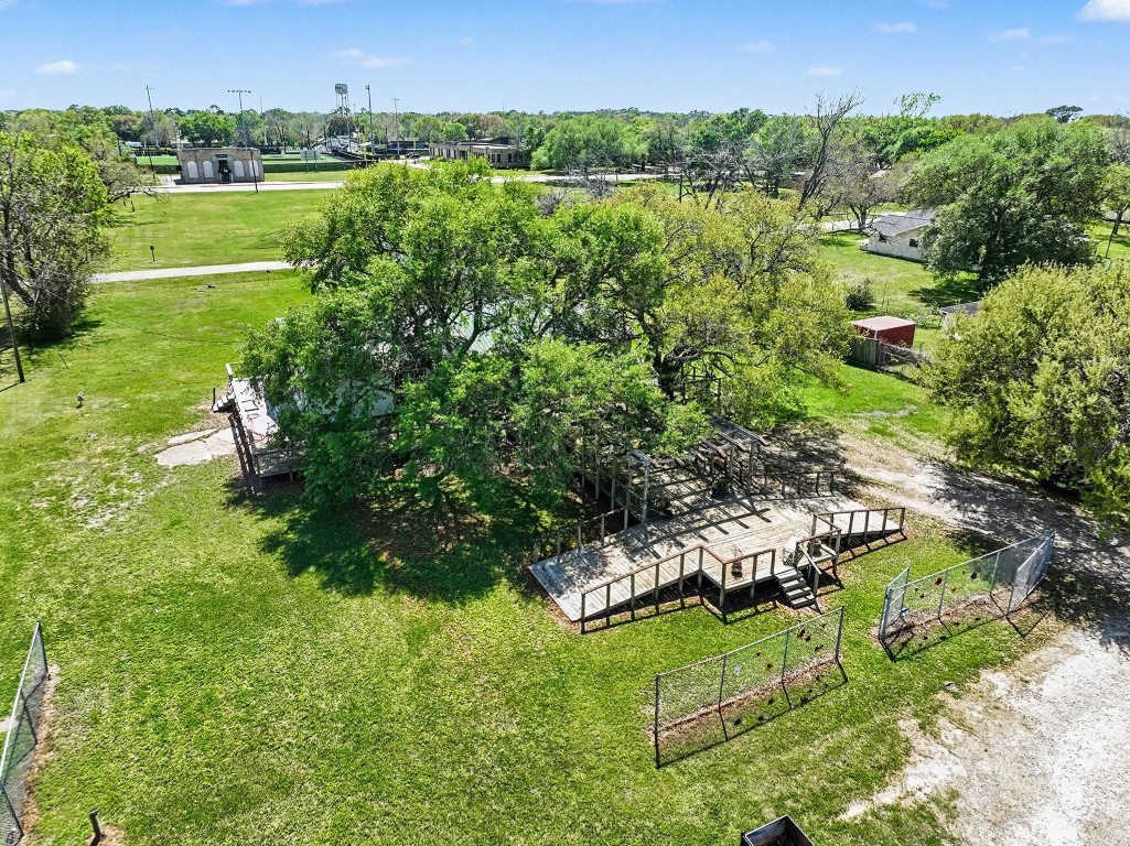 810 Miller Street Anahuac, TX 77514 - Photo 3 of 28 a view of a garden with a lake
