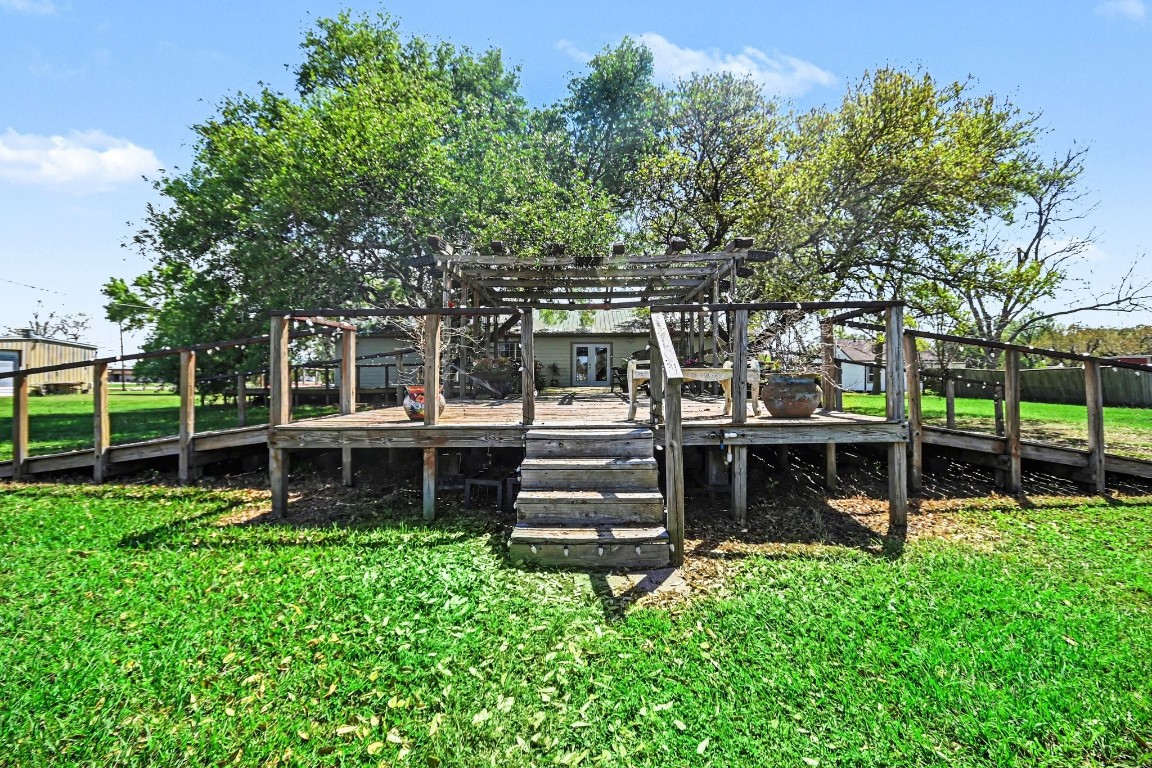 810 Miller Street Anahuac, TX 77514 - Photo 5 of 28 front view of a house with a large tree