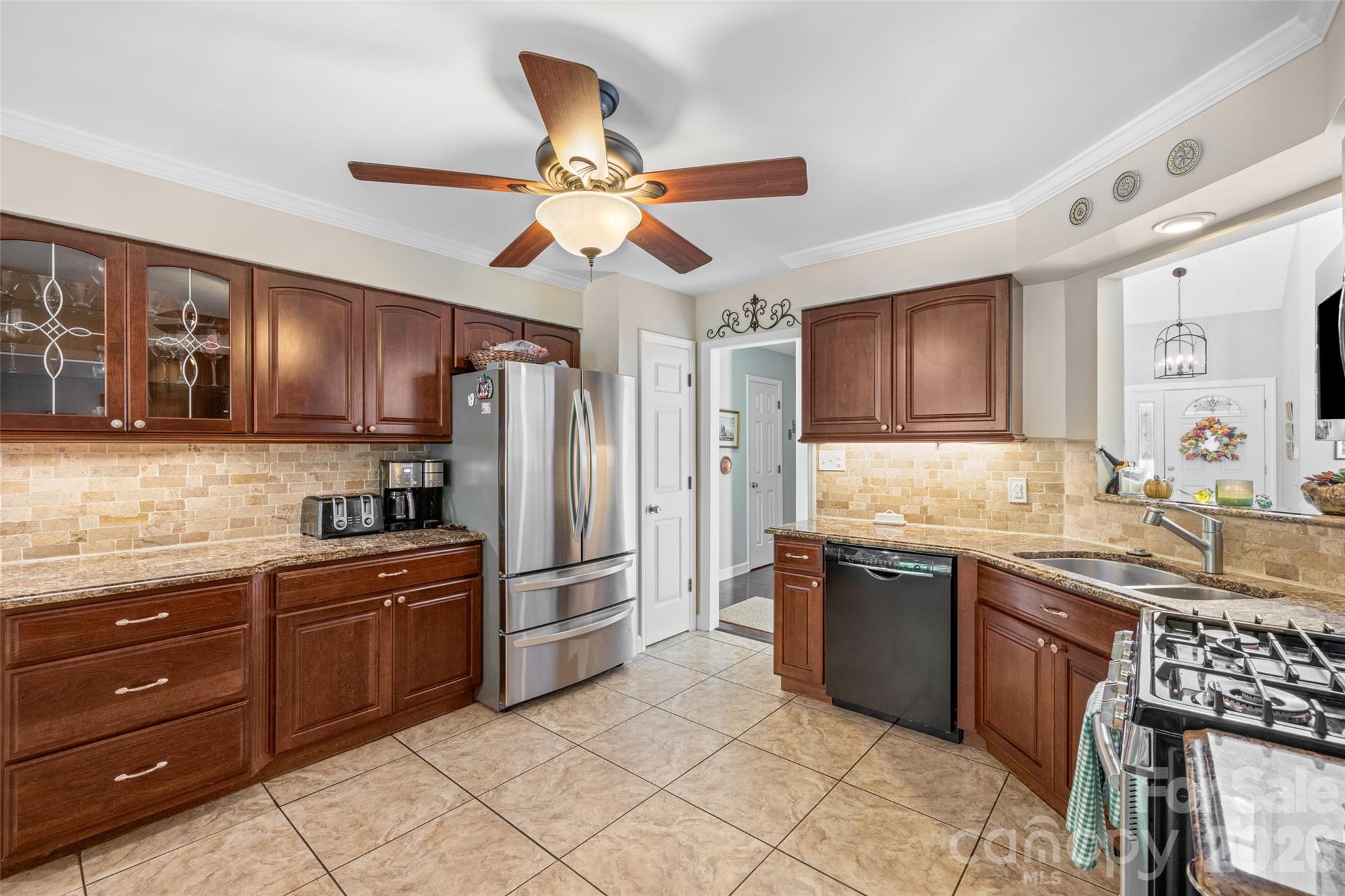 1326 Clifflure Lane Fort Mill, SC 29708 - Photo 14 of 46 a kitchen with granite countertop stainless steel appliances a sink and cabinets