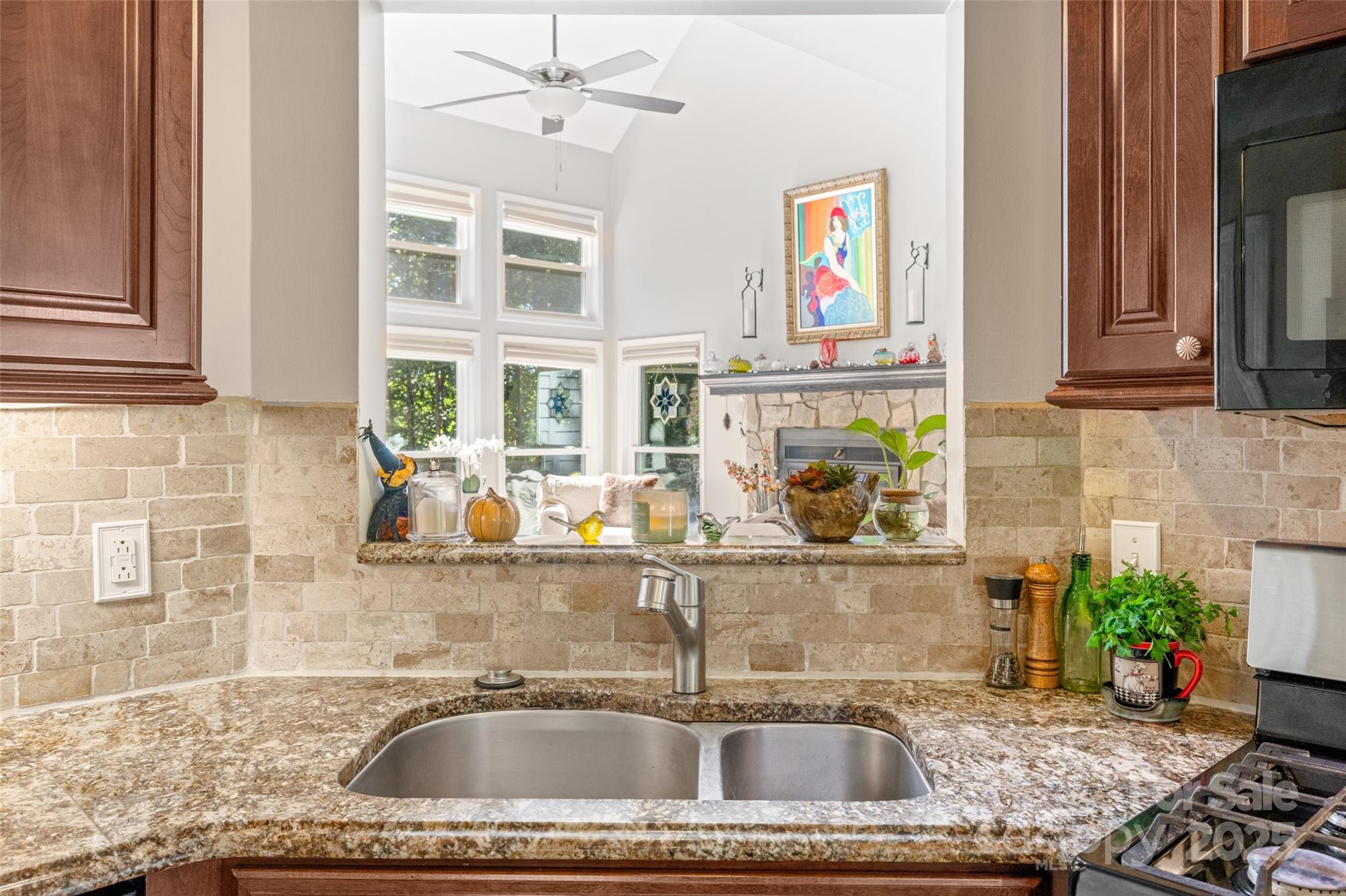 1326 Clifflure Lane Fort Mill, SC 29708 - Photo 17 of 47 a kitchen with a sink a faucet cabinets and a window