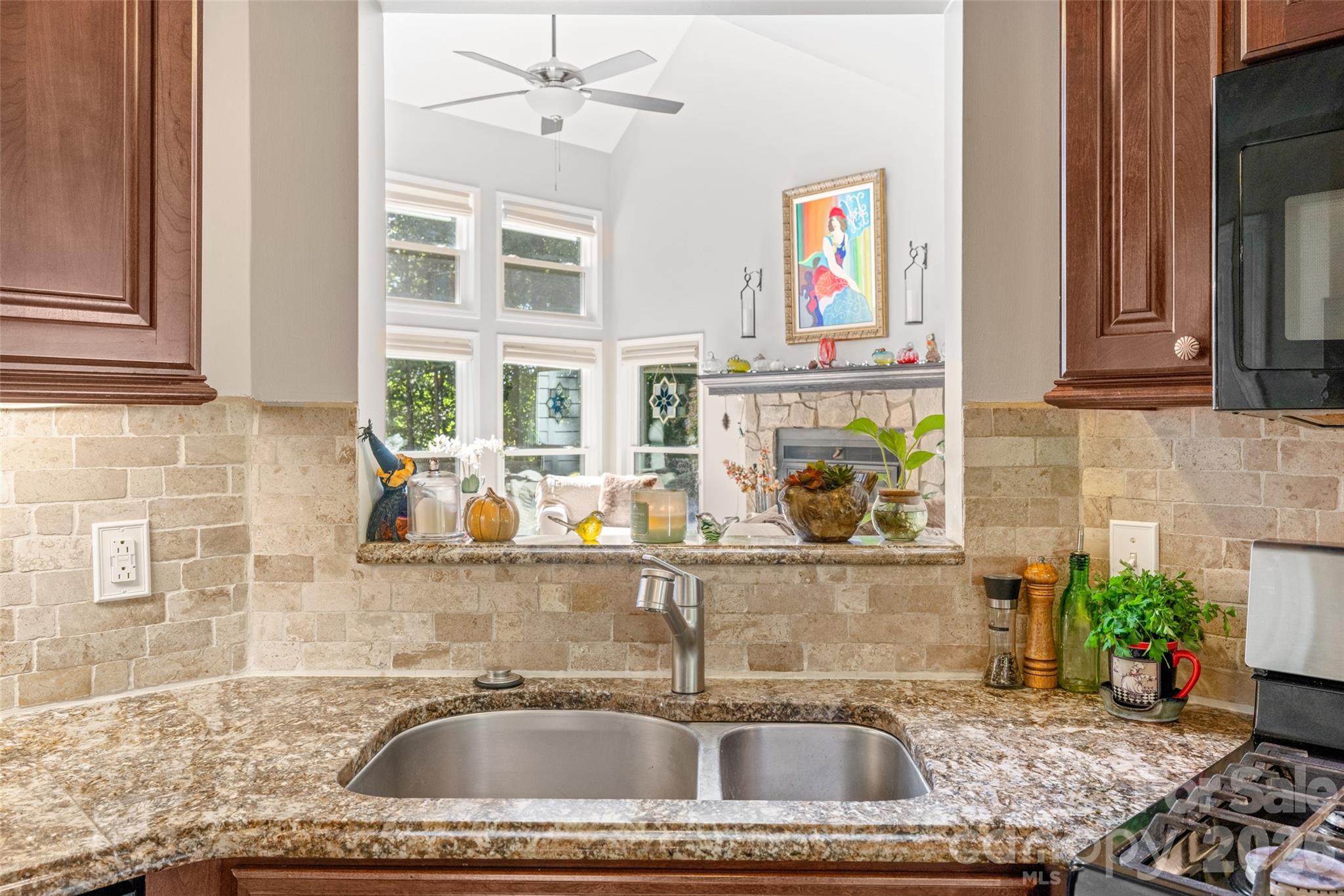 1326 Clifflure Lane Fort Mill, SC 29708 - Photo 17 of 46 a kitchen with a sink a faucet cabinets and a window
