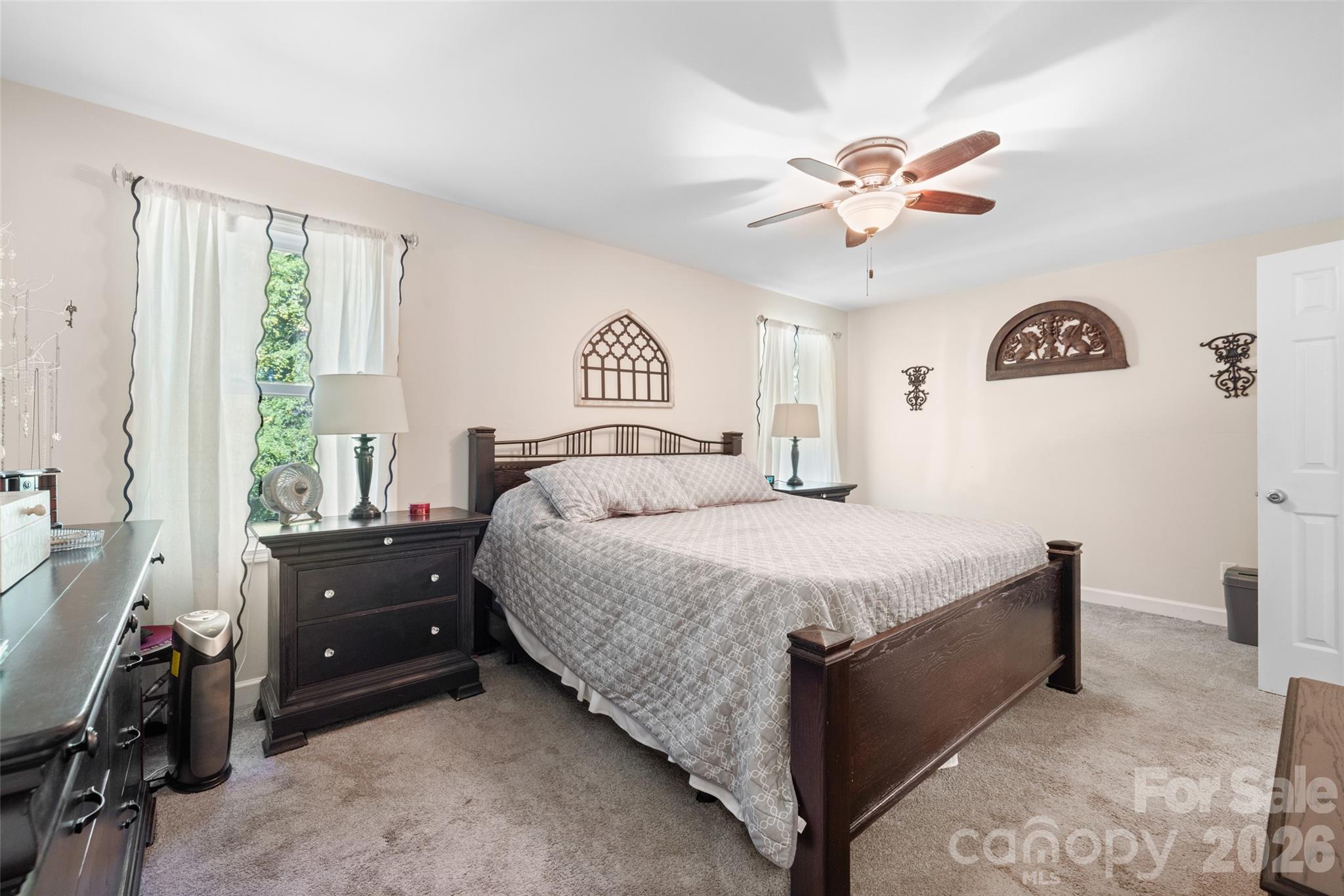 1326 Clifflure Lane Fort Mill, SC 29708 - Photo 20 of 46 a bedroom with a bed and a chandelier