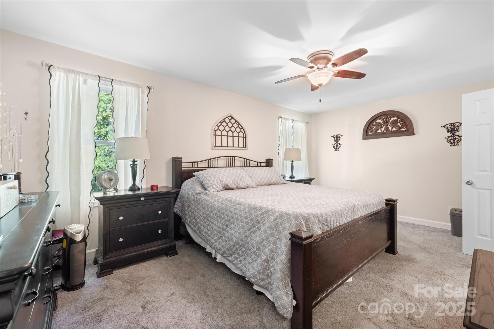 1326 Clifflure Lane Fort Mill, SC 29708 - Photo 20 of 47 a bedroom with a bed and a chandelier