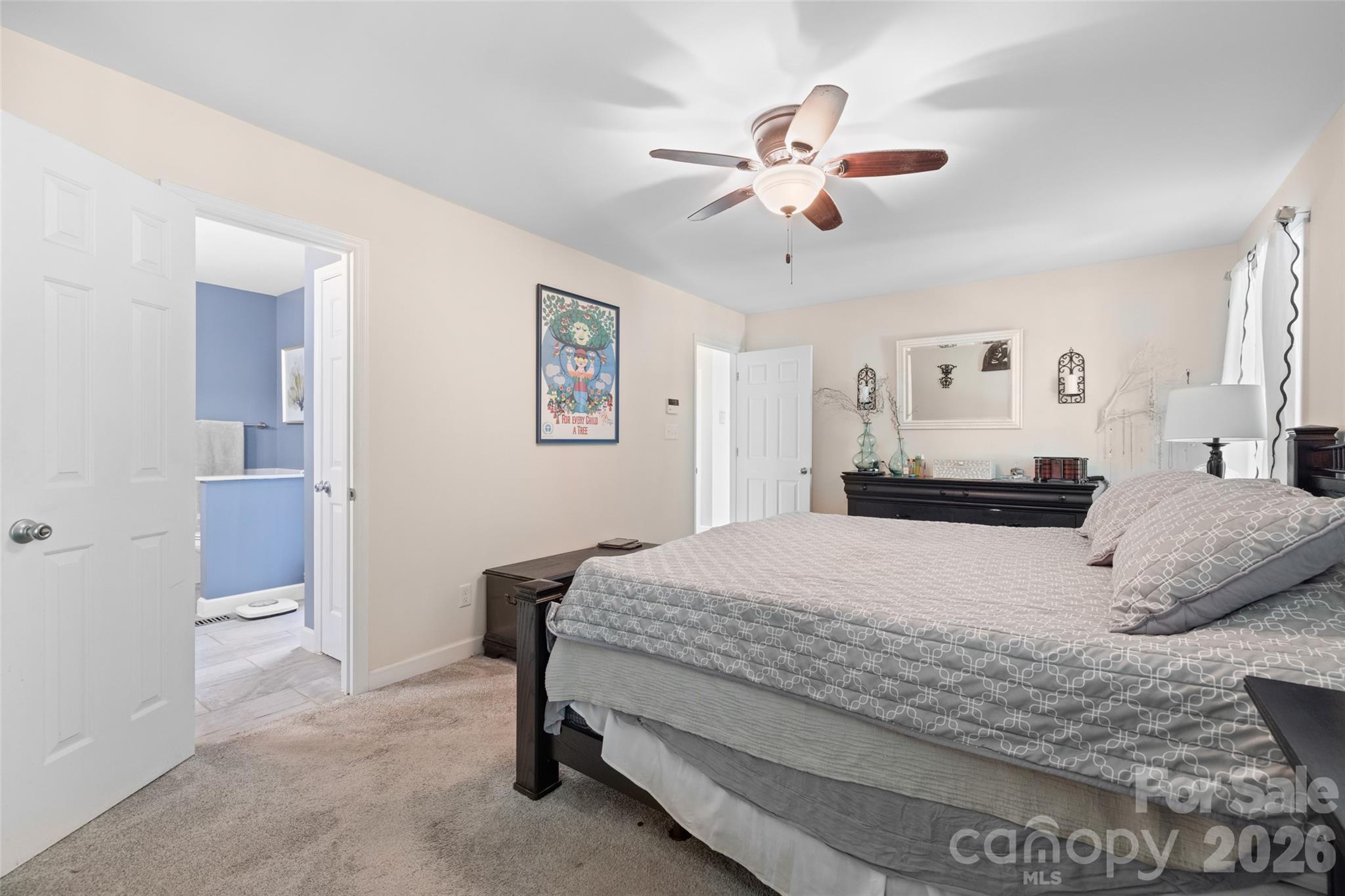 1326 Clifflure Lane Fort Mill, SC 29708 - Photo 21 of 46 a bedroom with a bed and a chandelier