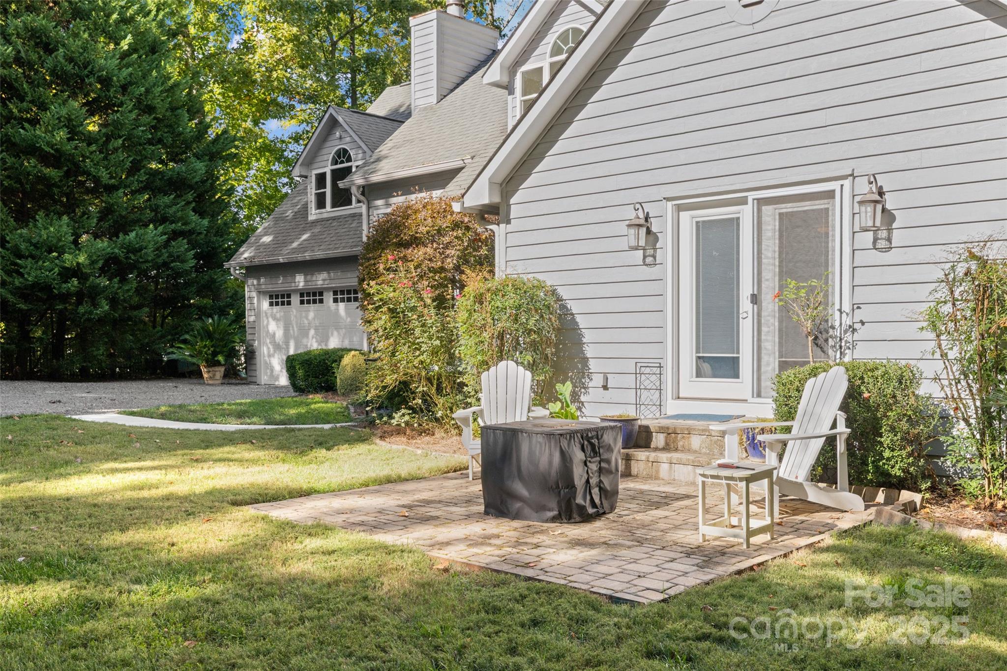 1326 Clifflure Lane Fort Mill, SC 29708 - Photo 3 of 47 a view of a chair and table in backyard of the house