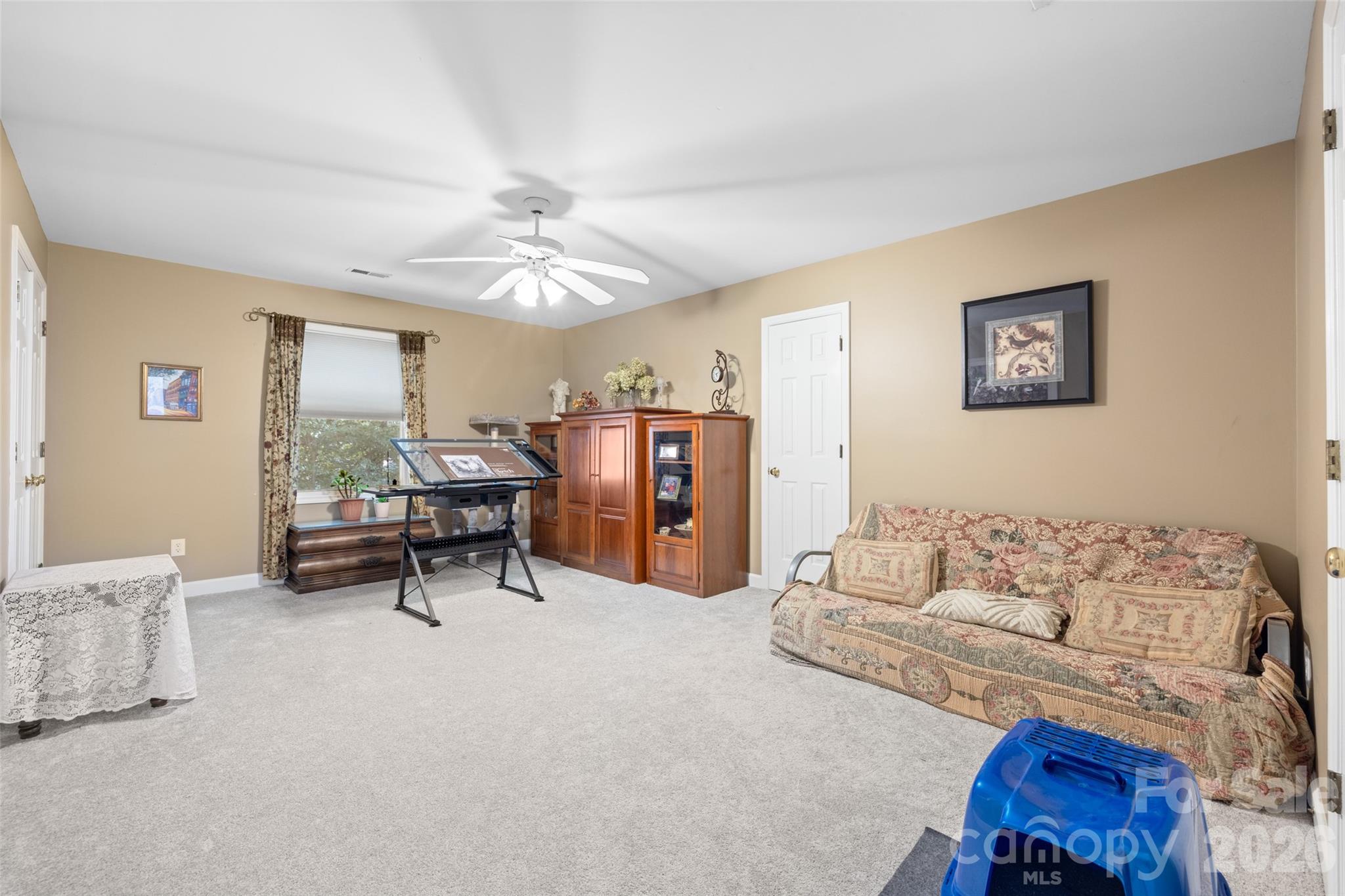 1326 Clifflure Lane Fort Mill, SC 29708 - Photo 32 of 46 a living room with furniture and a chandelier