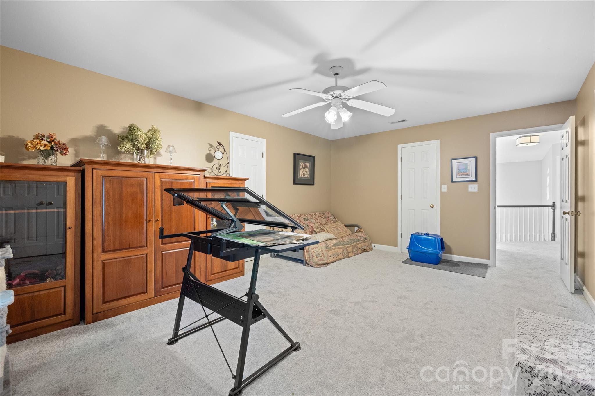1326 Clifflure Lane Fort Mill, SC 29708 - Photo 33 of 46 a view of a livingroom with furniture and a ceiling fan