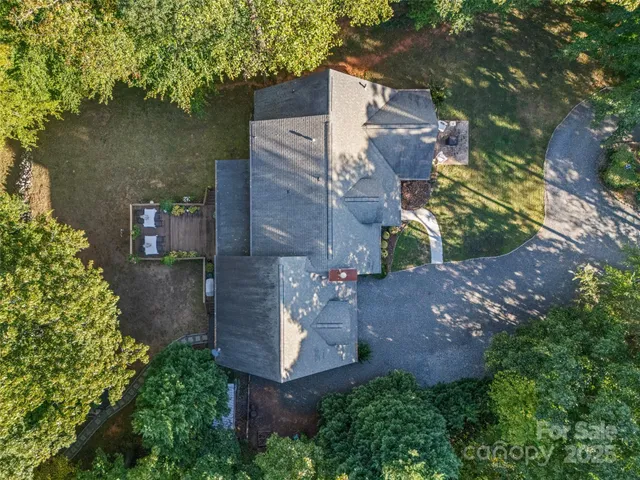 an aerial view of a house with outdoor space