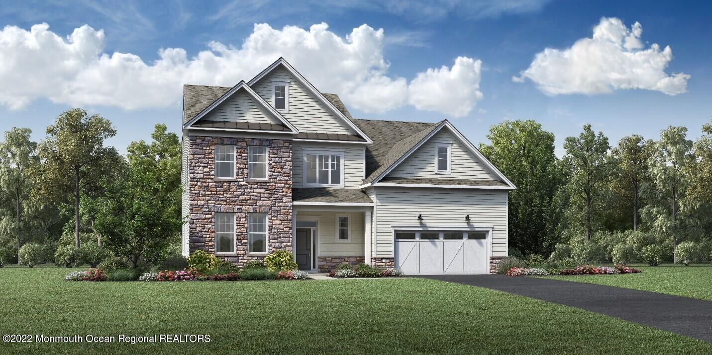 2 Sofia Drive Manalapan, NJ 07726 - Photo 1 of 1 a front view of a house with a garden and plants