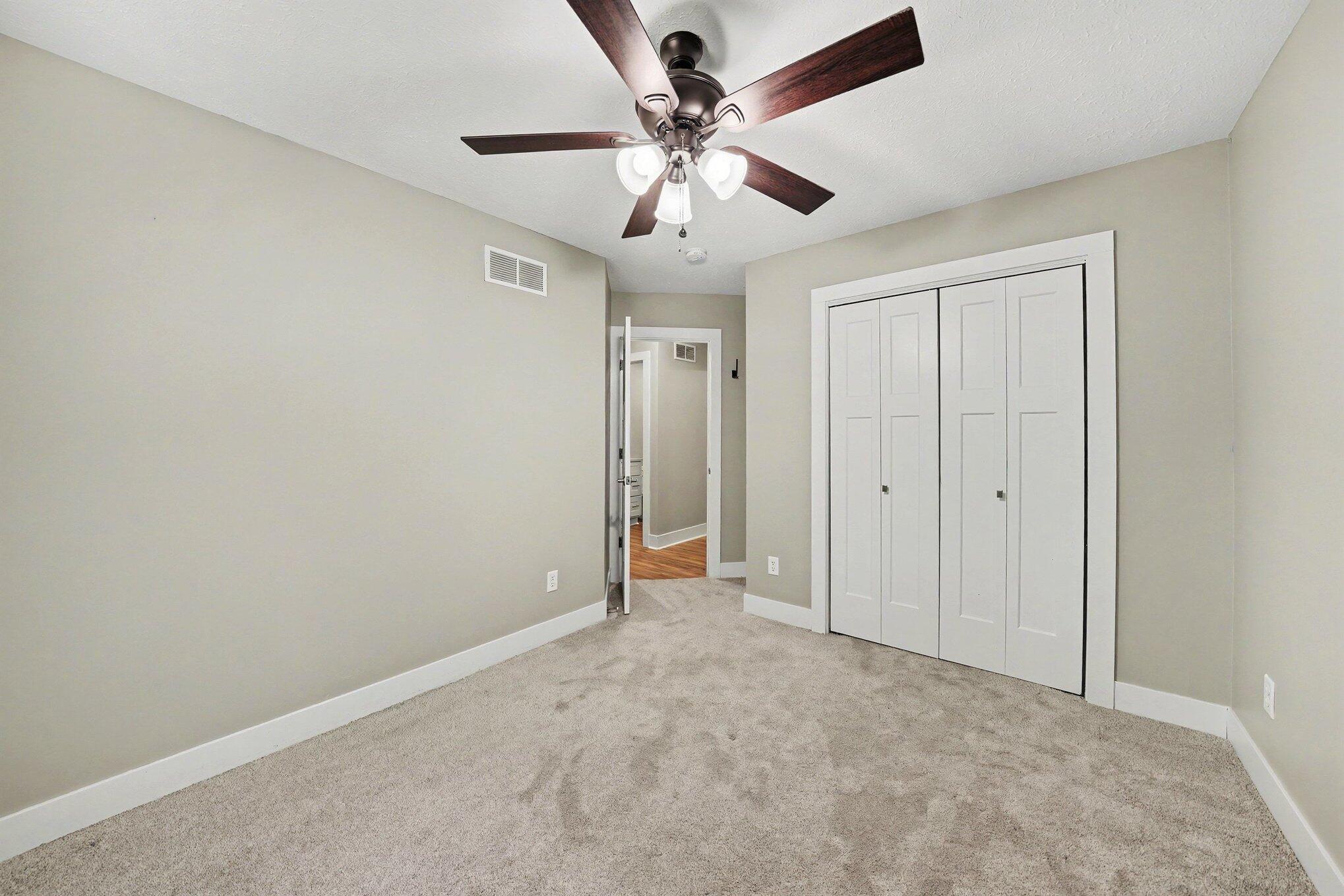 7563 East 400 North Rolling Prairie, IN 46371 - Photo 9 of 17 wooden floor in an empty room