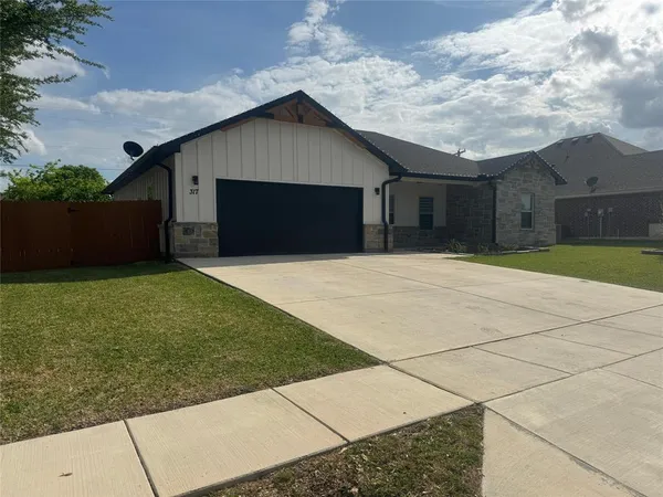 a front view of house with yard
